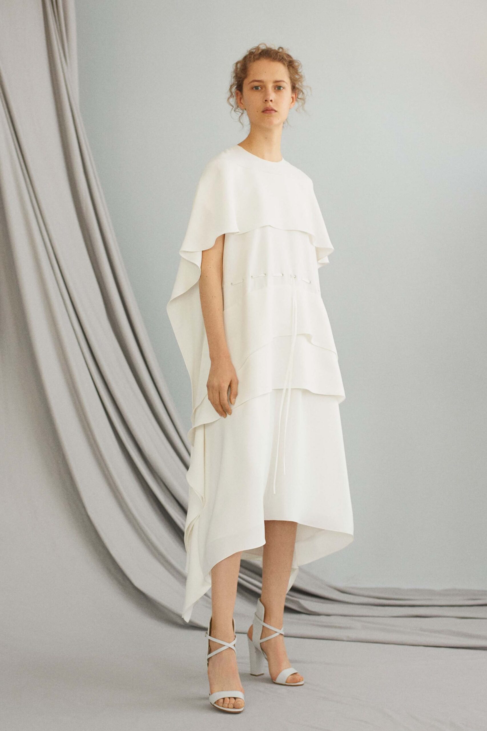 white layered midi dress with strappy shoes