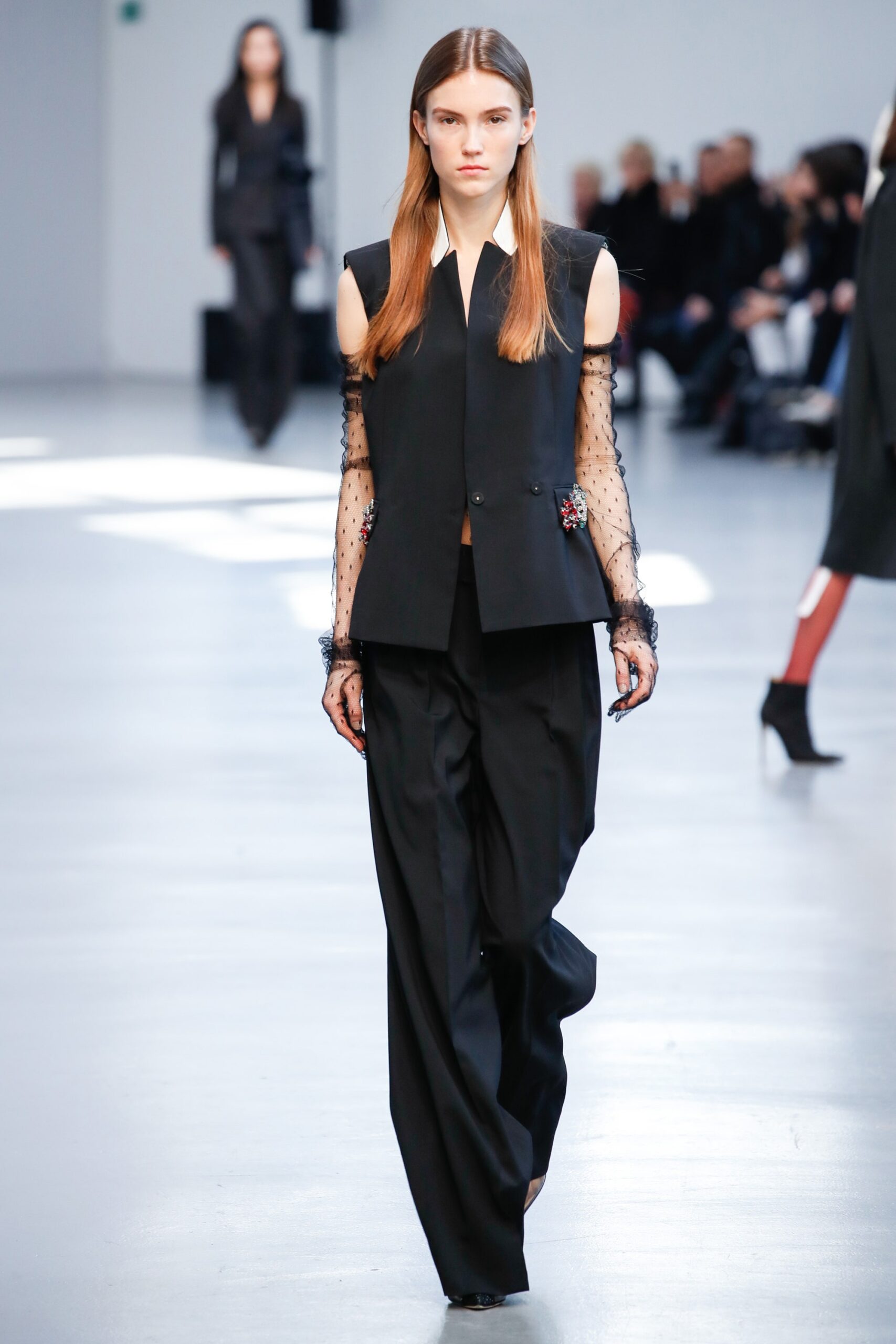black fitted blazer and relaxed pants