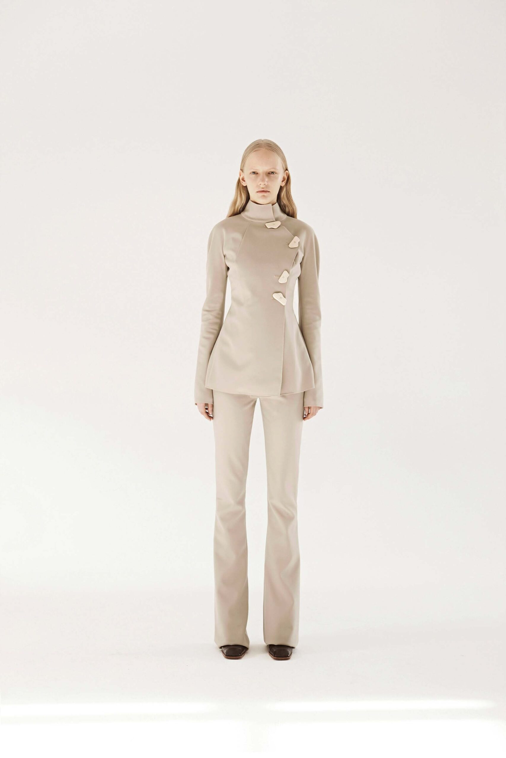 beige fitted top and flared pants