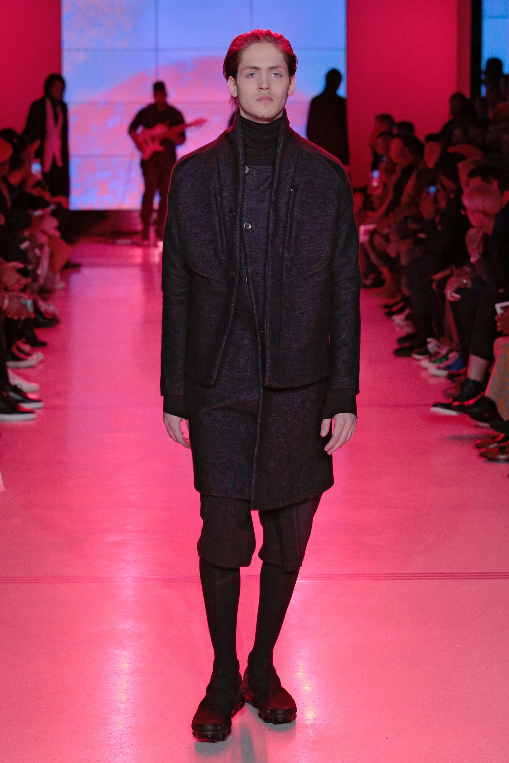 black wool coat with relaxed pants
