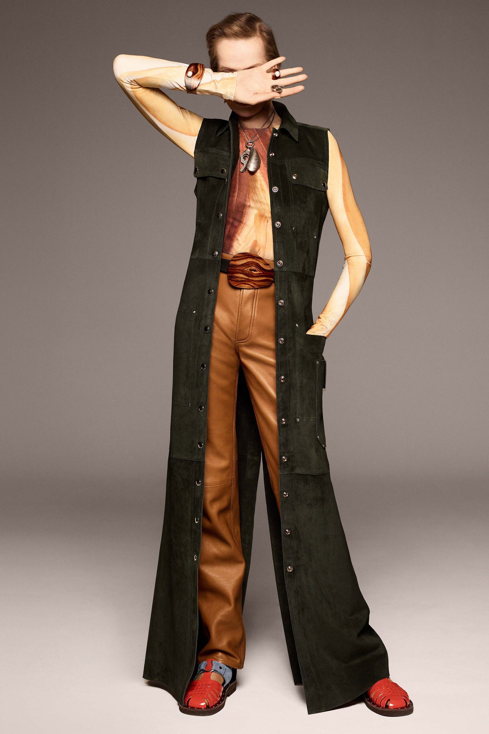 green suede sleeveless collared fitted buttoned pockets jumpsuit