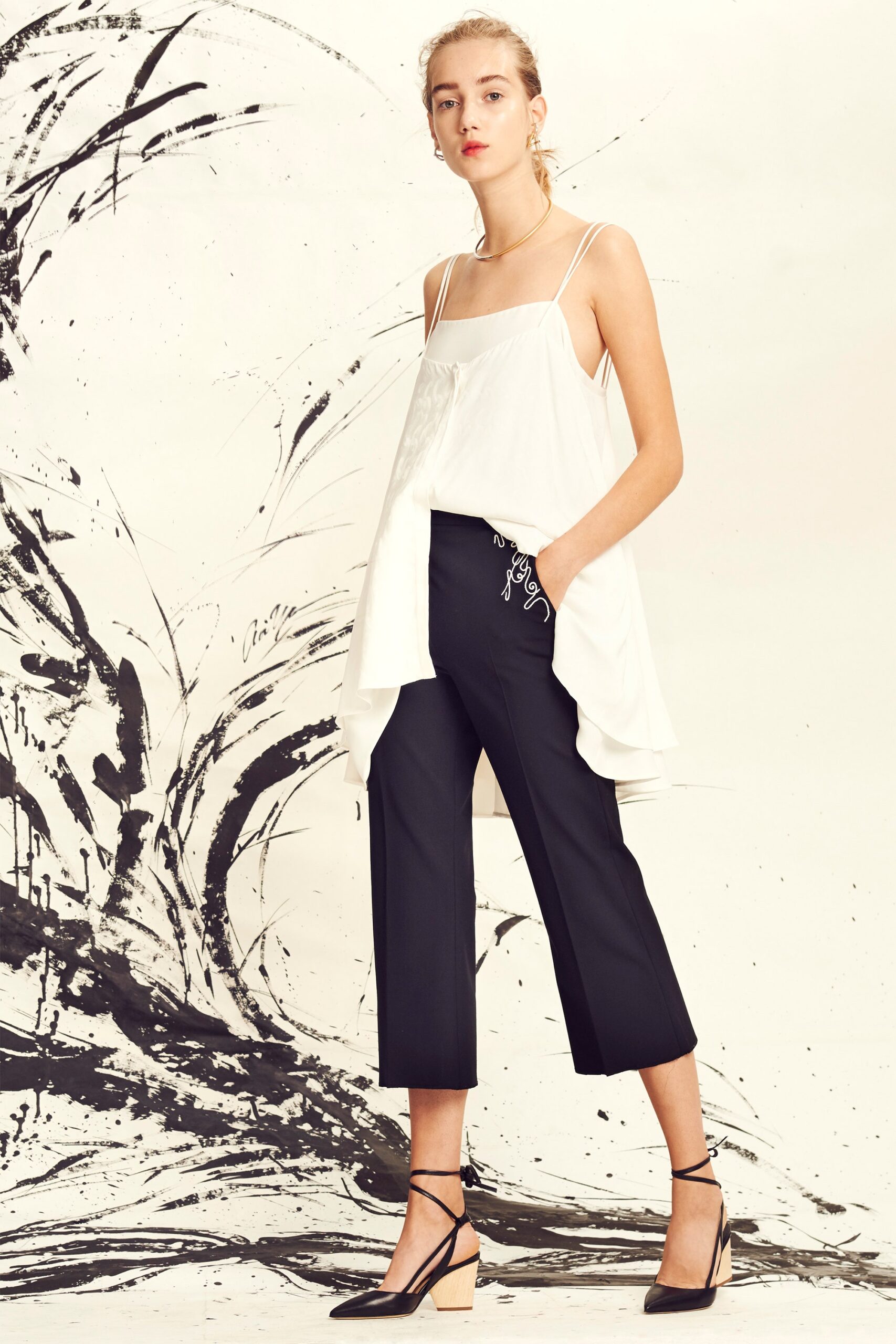 white silk sleeveless high-neck relaxed draped top