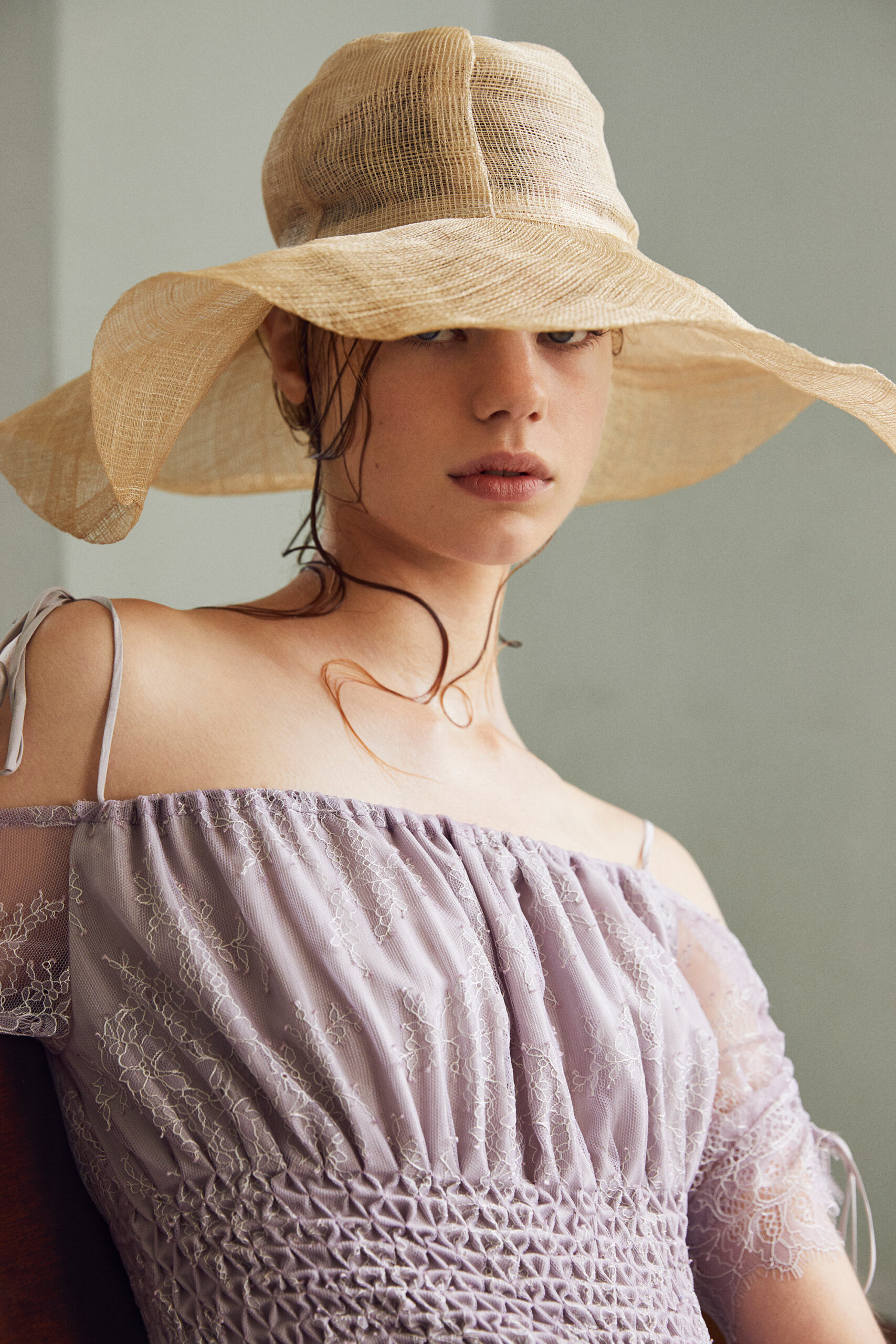 lavender embroidered off-shoulder dress with beige hat