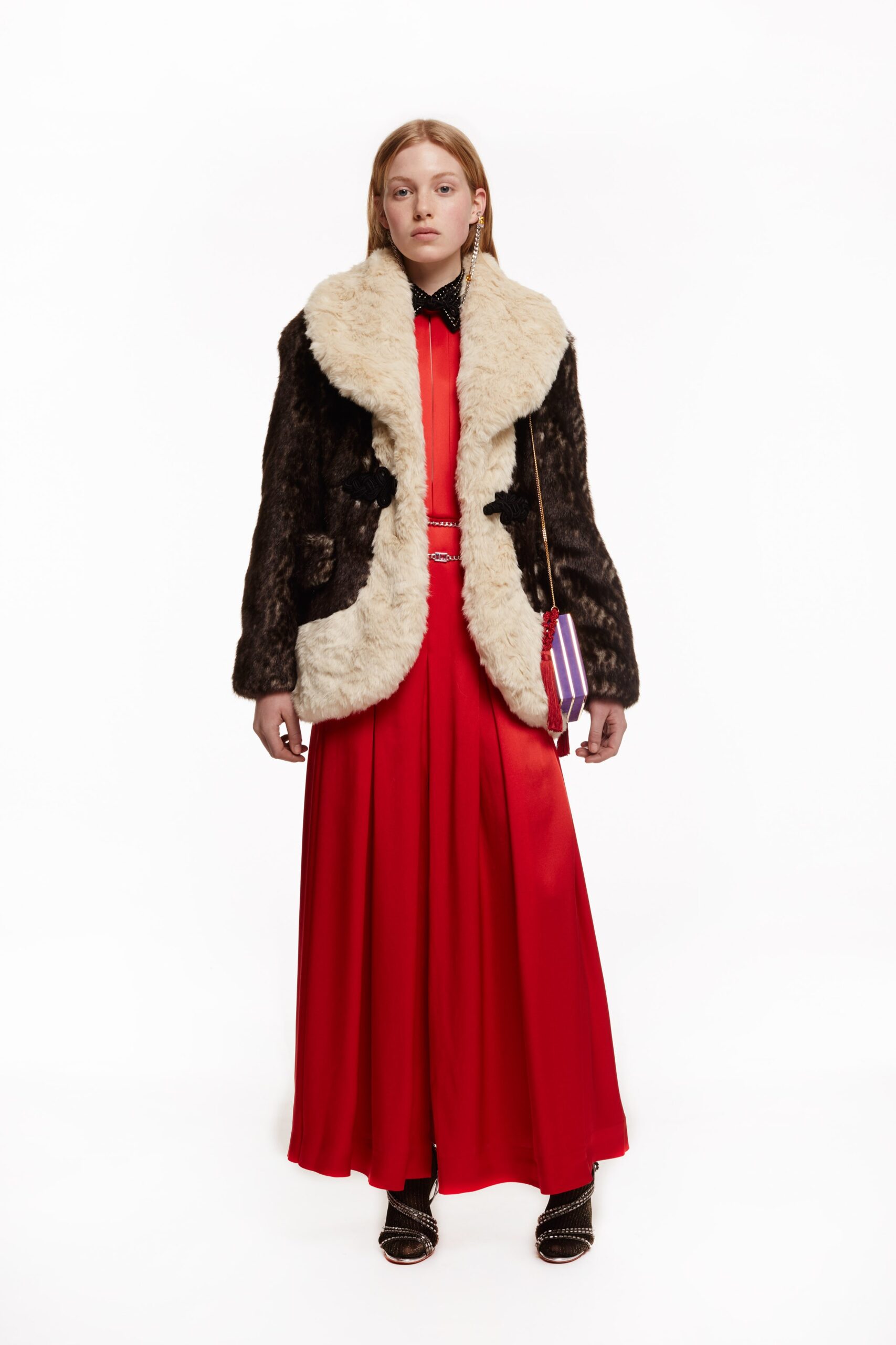 brown faux-fur coat and red silk dress