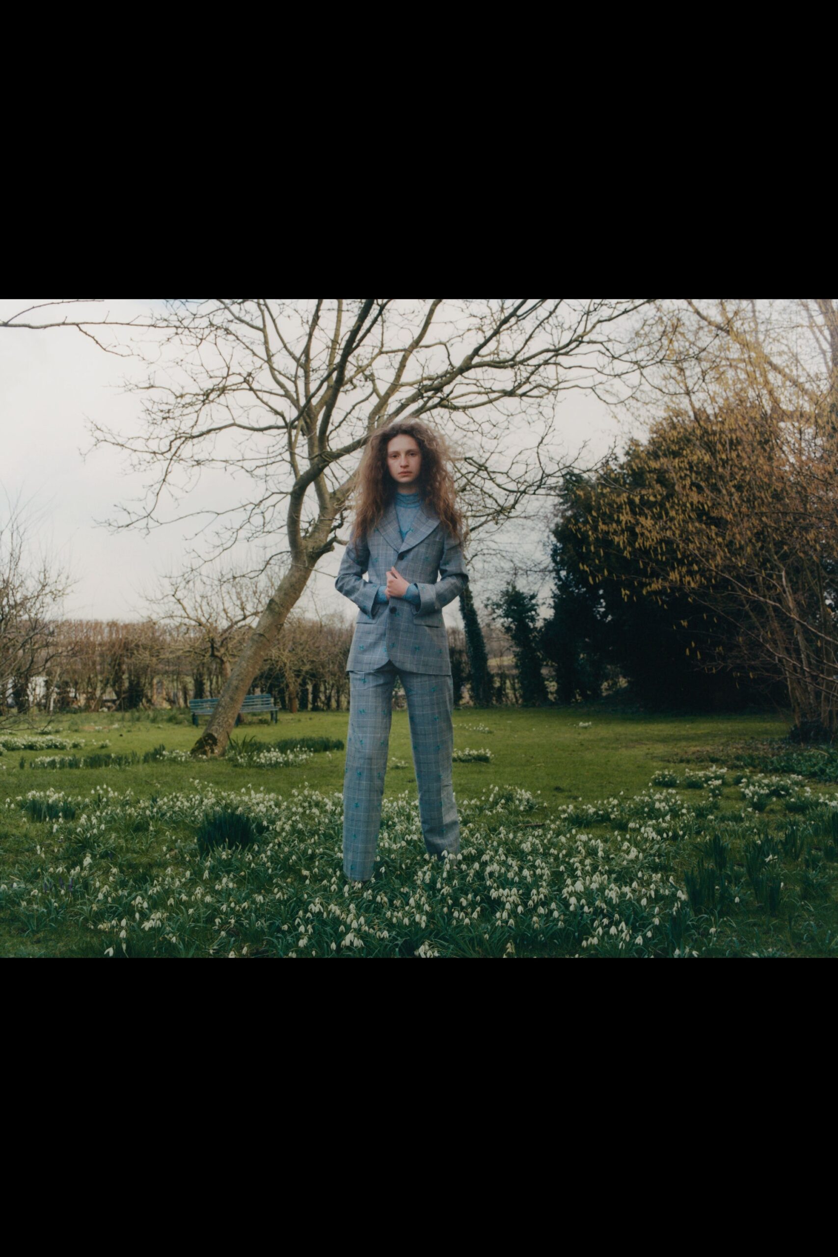 gray tailored suit with blue top