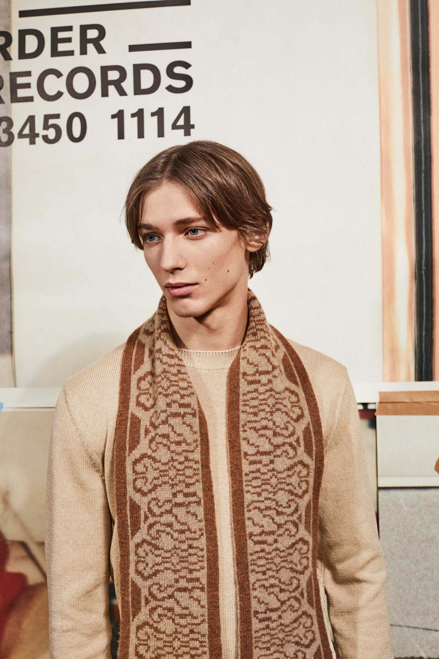 beige wool fitted sweater with patterned scarf