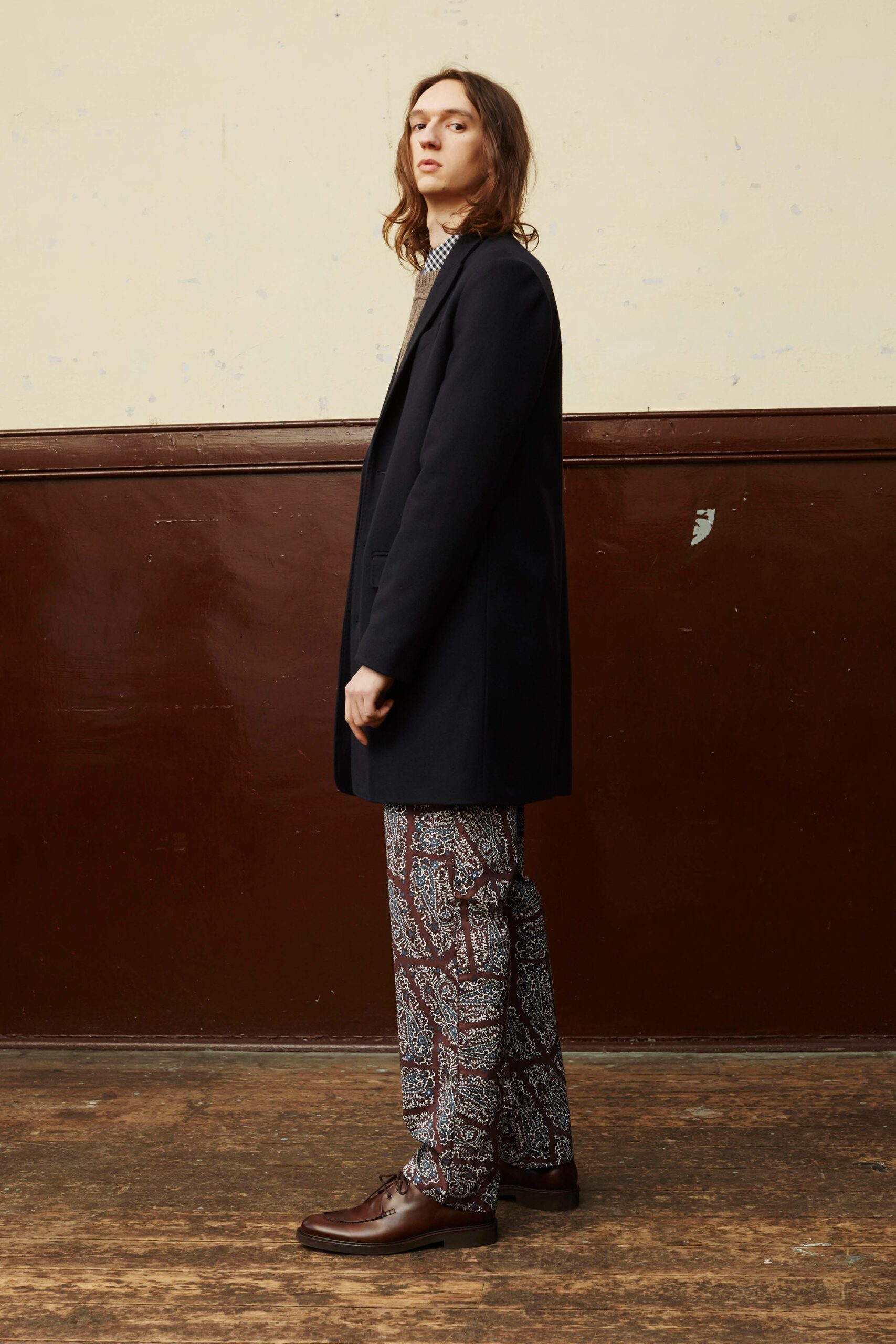black tailored coat with patterned pants