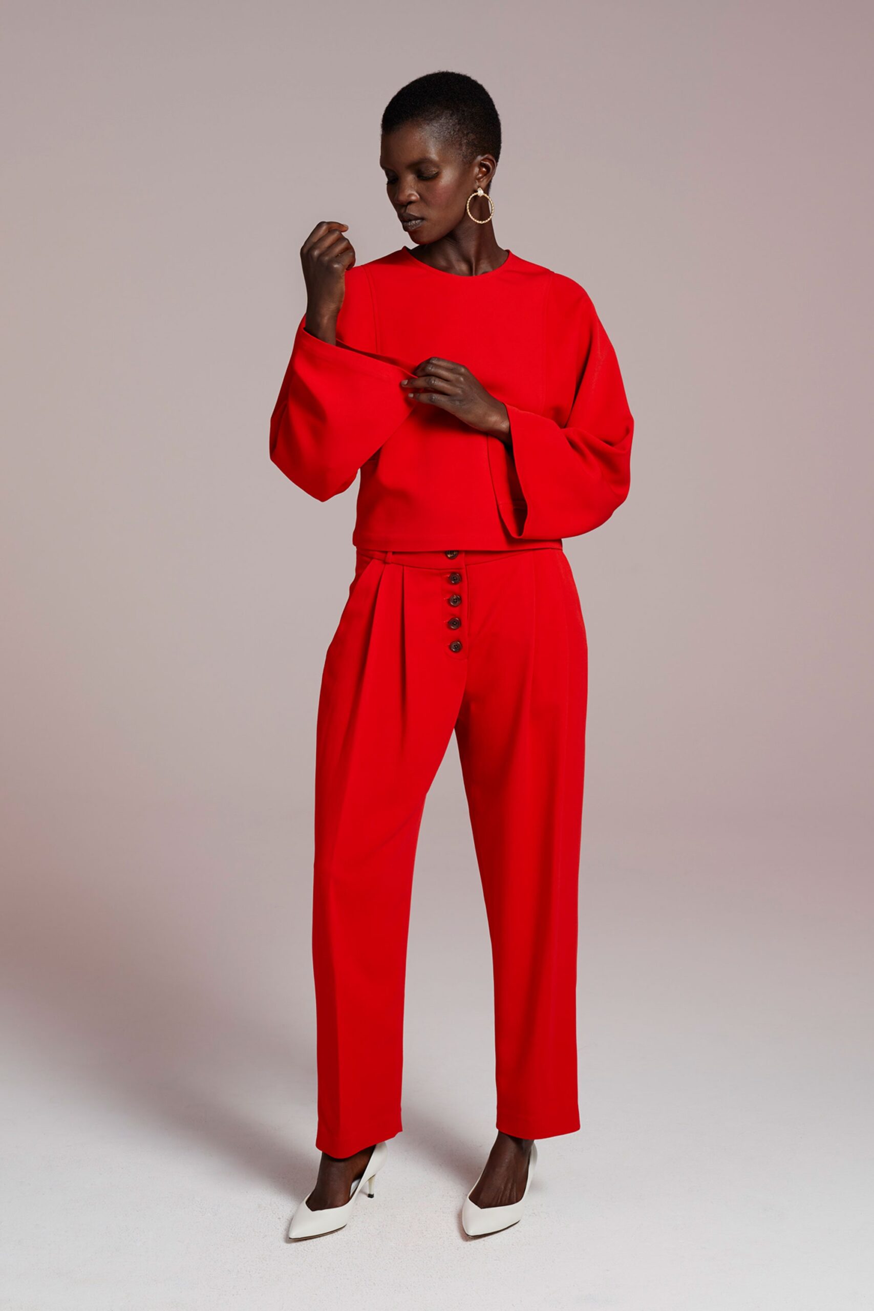 red long-sleeve collared fitted pleated top