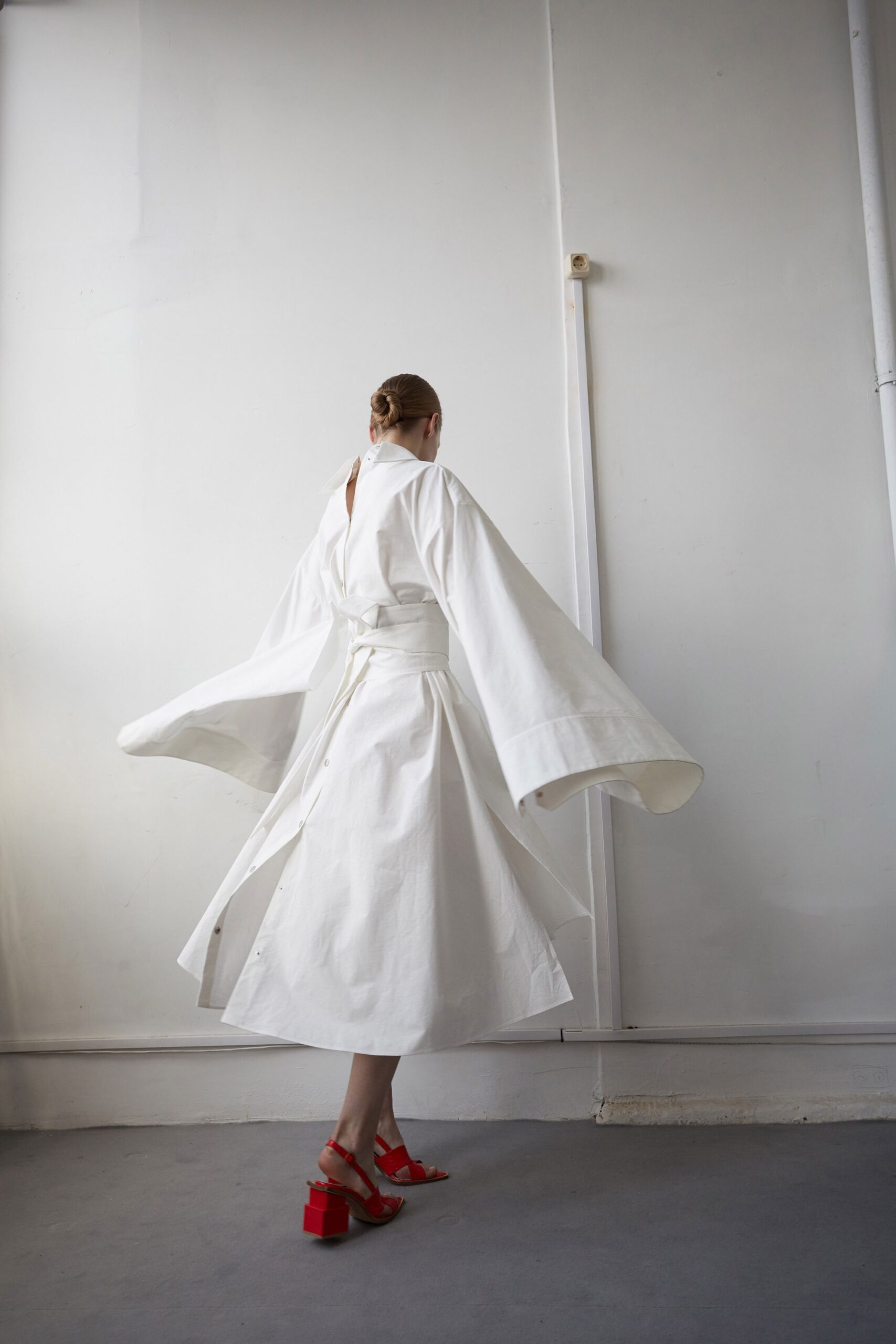 white cotton long-sleeve v-neck relaxed draped belted dress