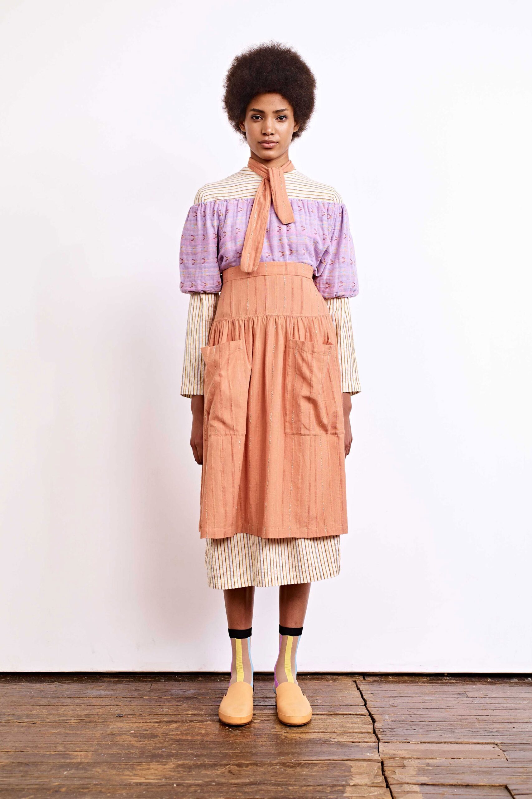 purple and orange pleated dress