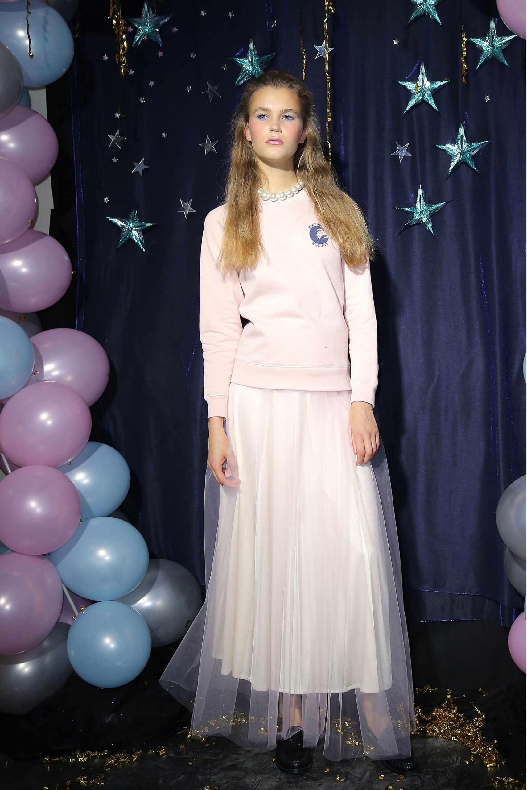 pink fitted sweater with white tulle skirt