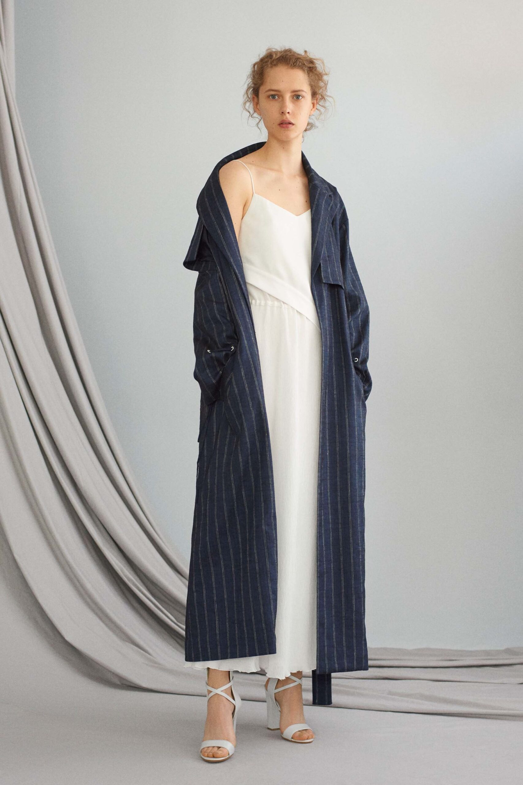 white fitted midi dress with blue coat