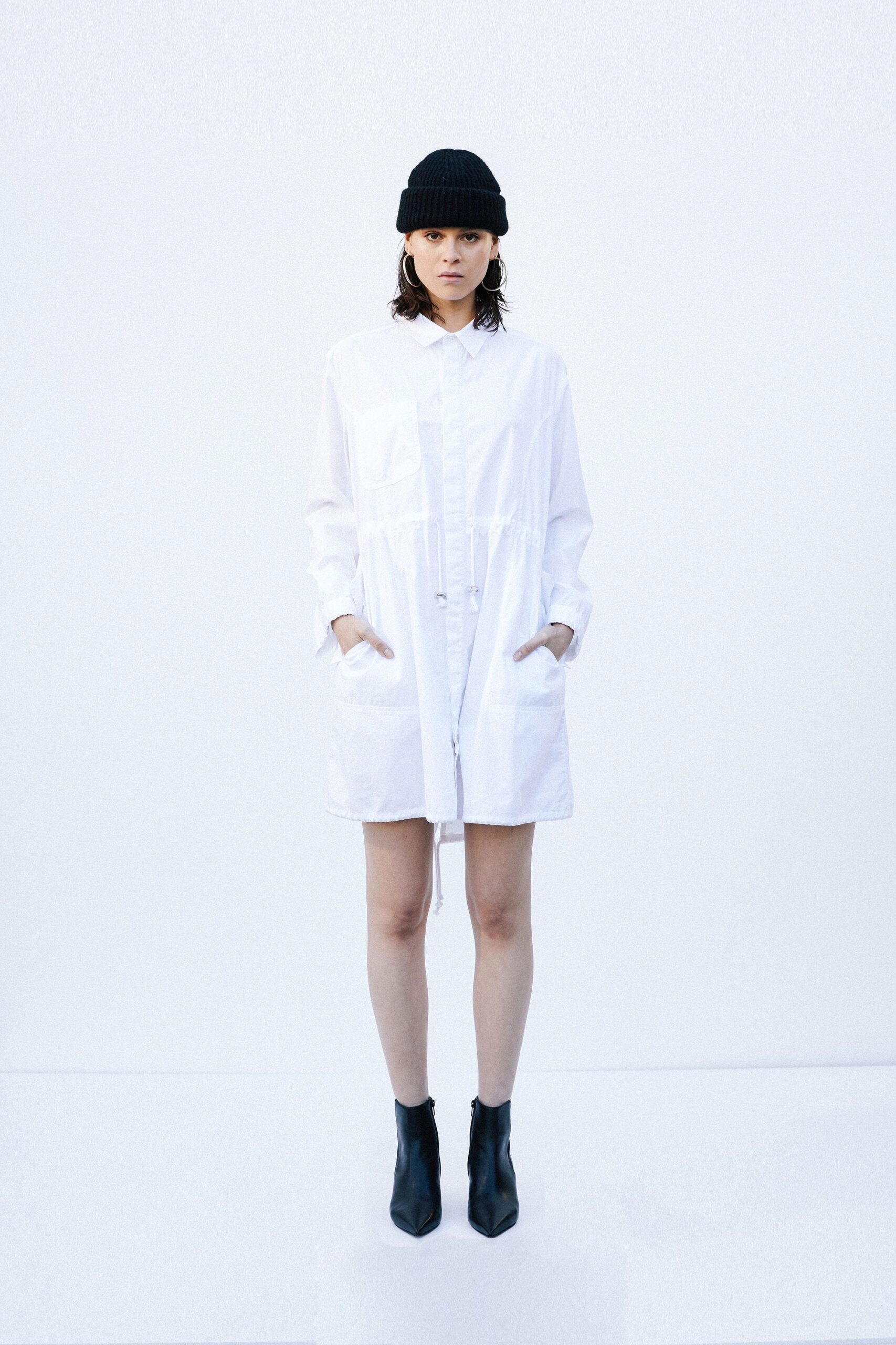 white relaxed shirt-dress with black boots