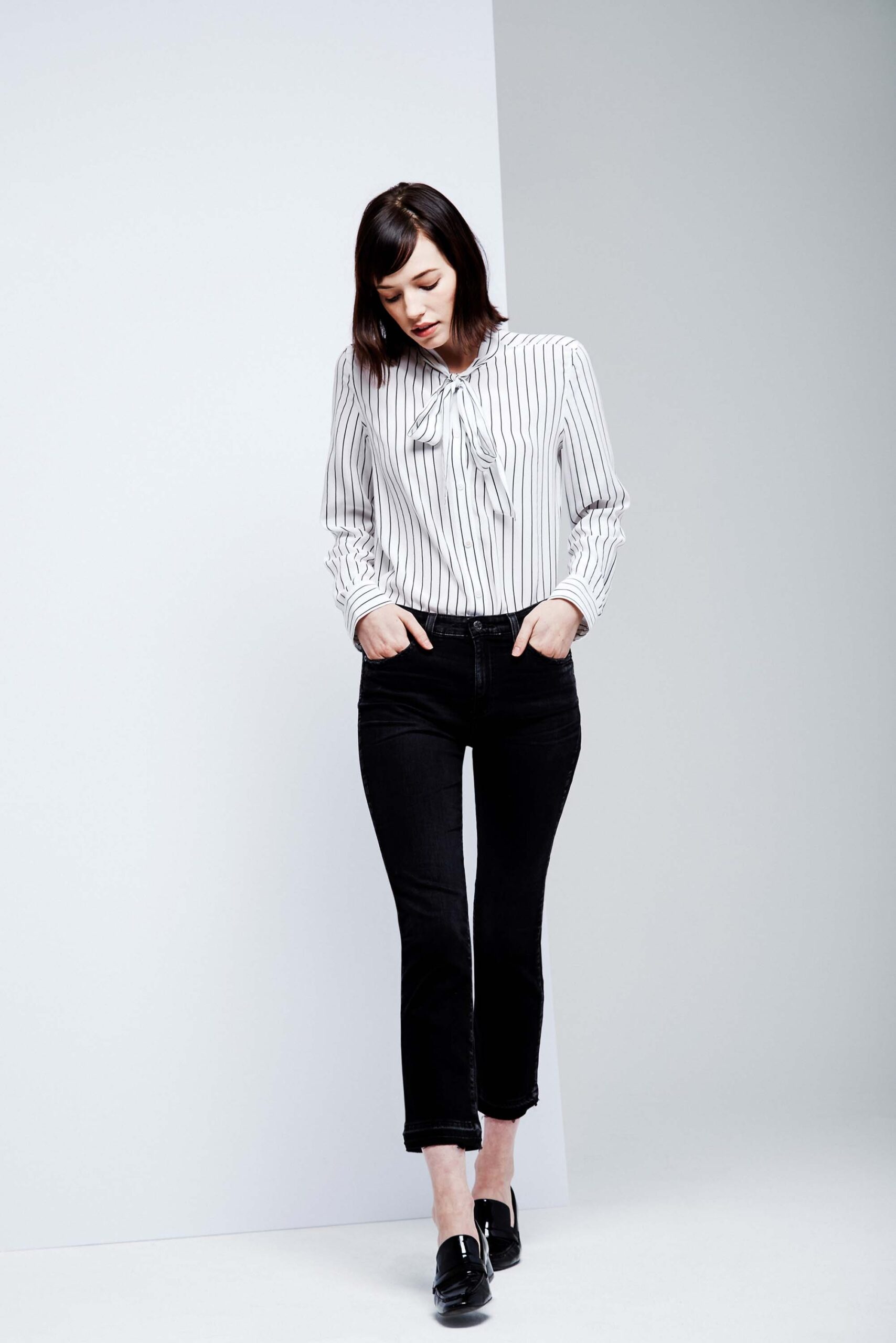 striped white shirt and black pants
