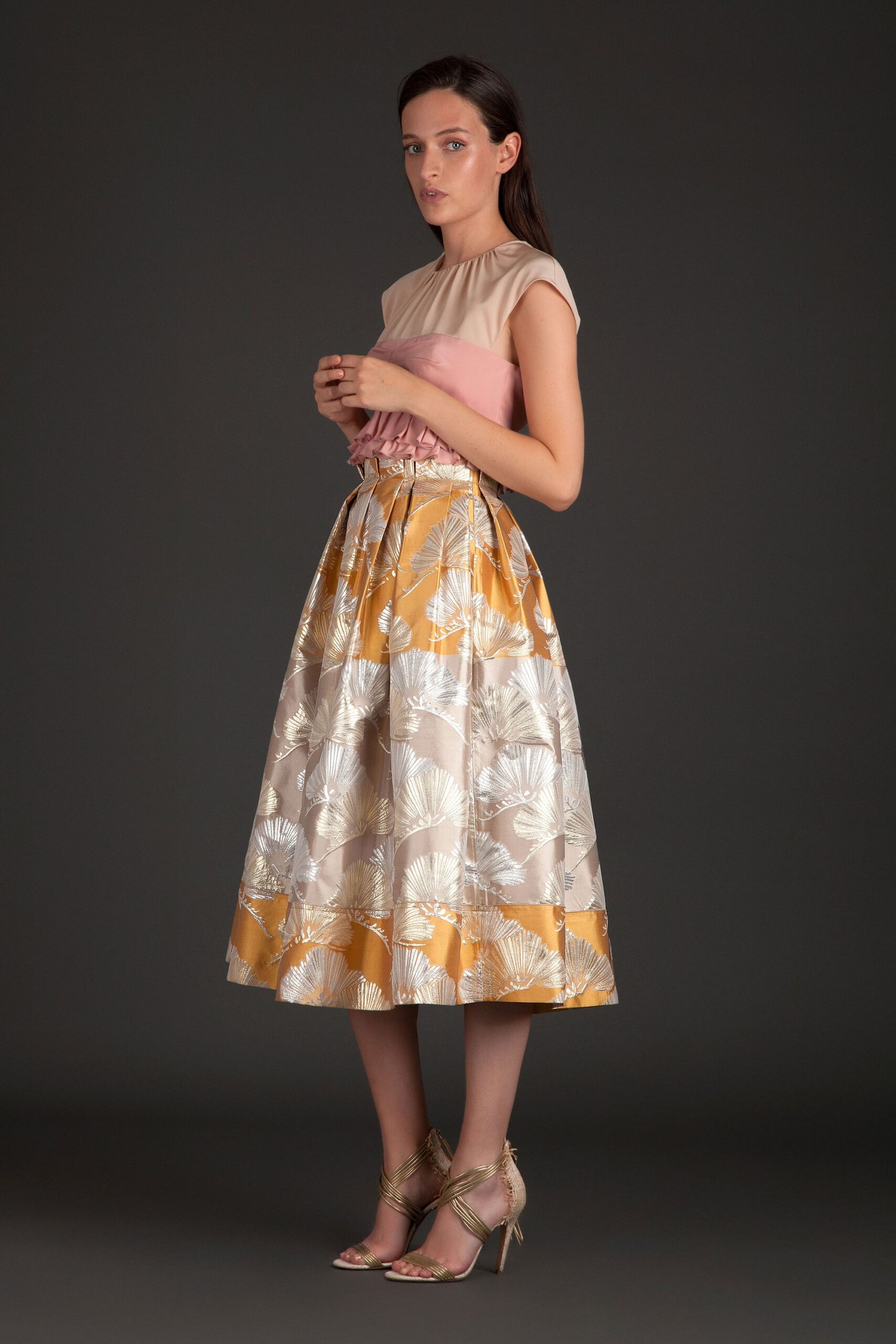 beige pink top with gold skirt