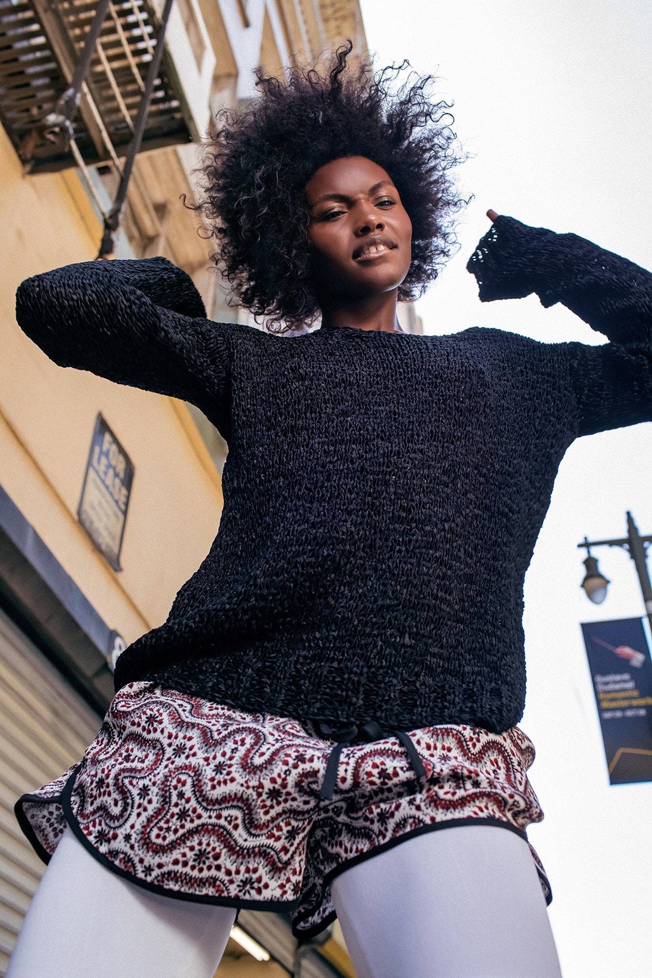 black knit top with printed shorts