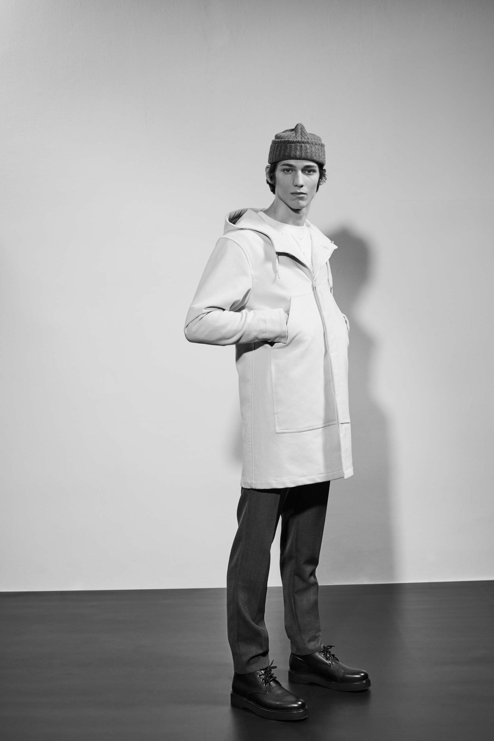 white relaxed coat with gray pants