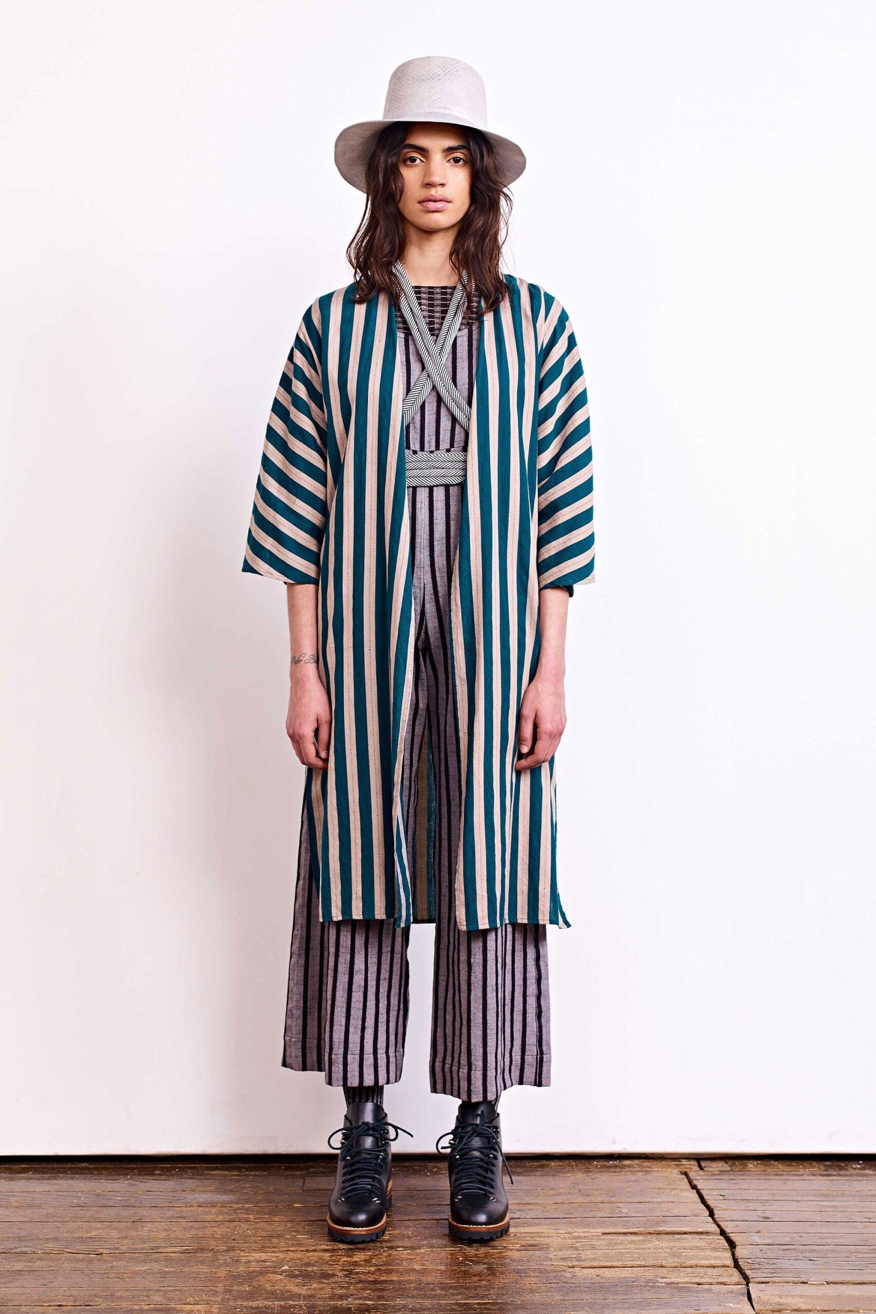 striped coat and gray jumpsuit