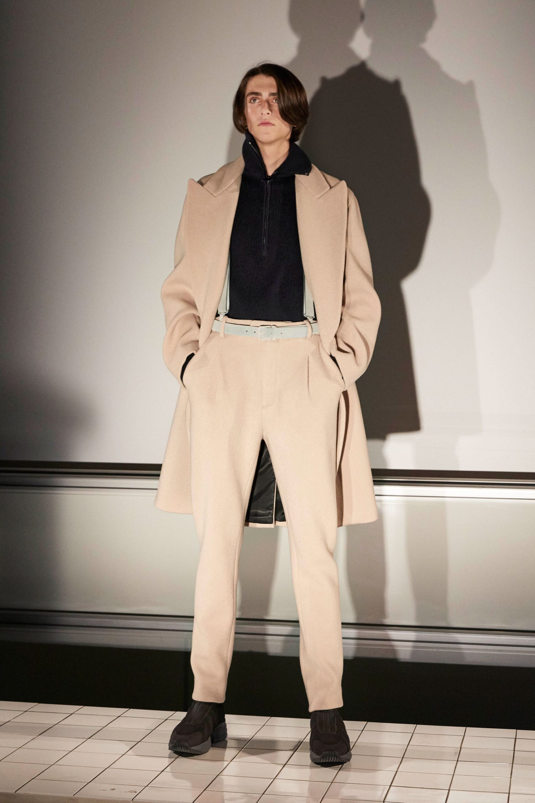 beige wool coat with black hoodie