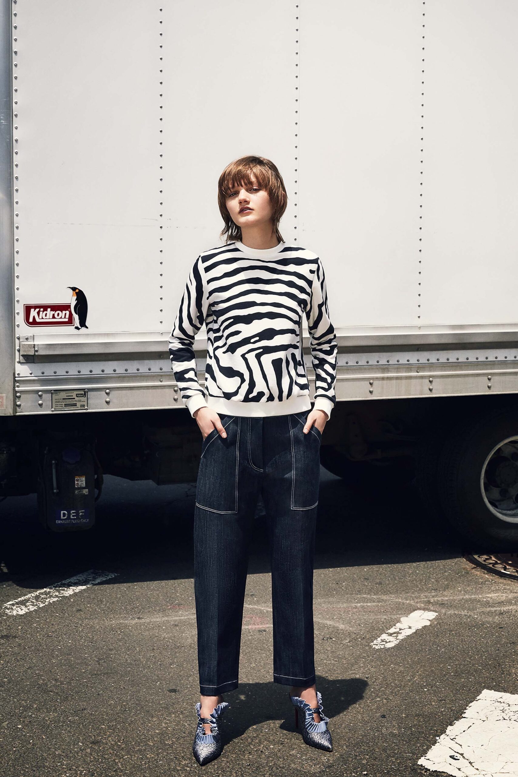 black and white printed sweater with denim pants