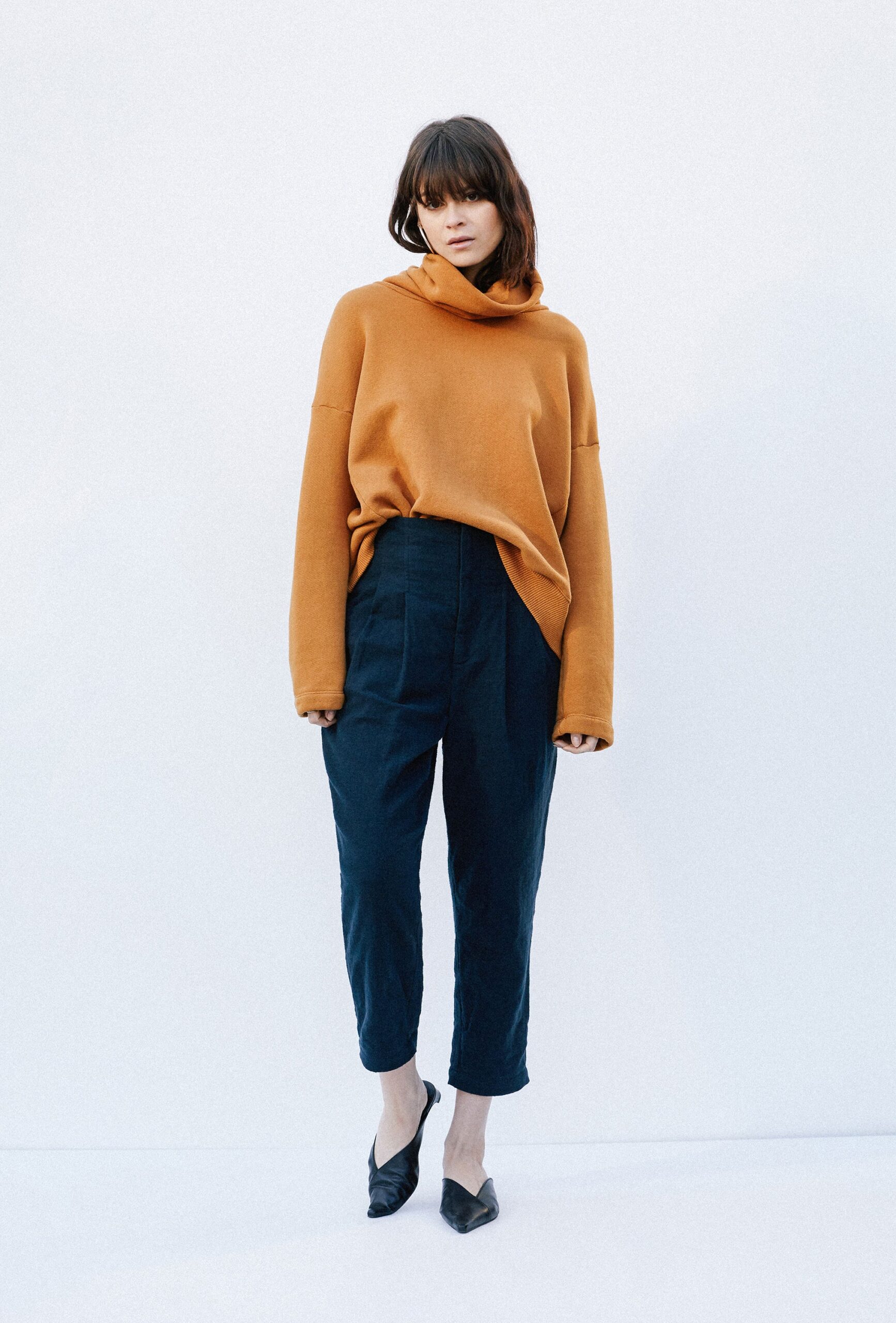 oversized orange sweater with relaxed pants