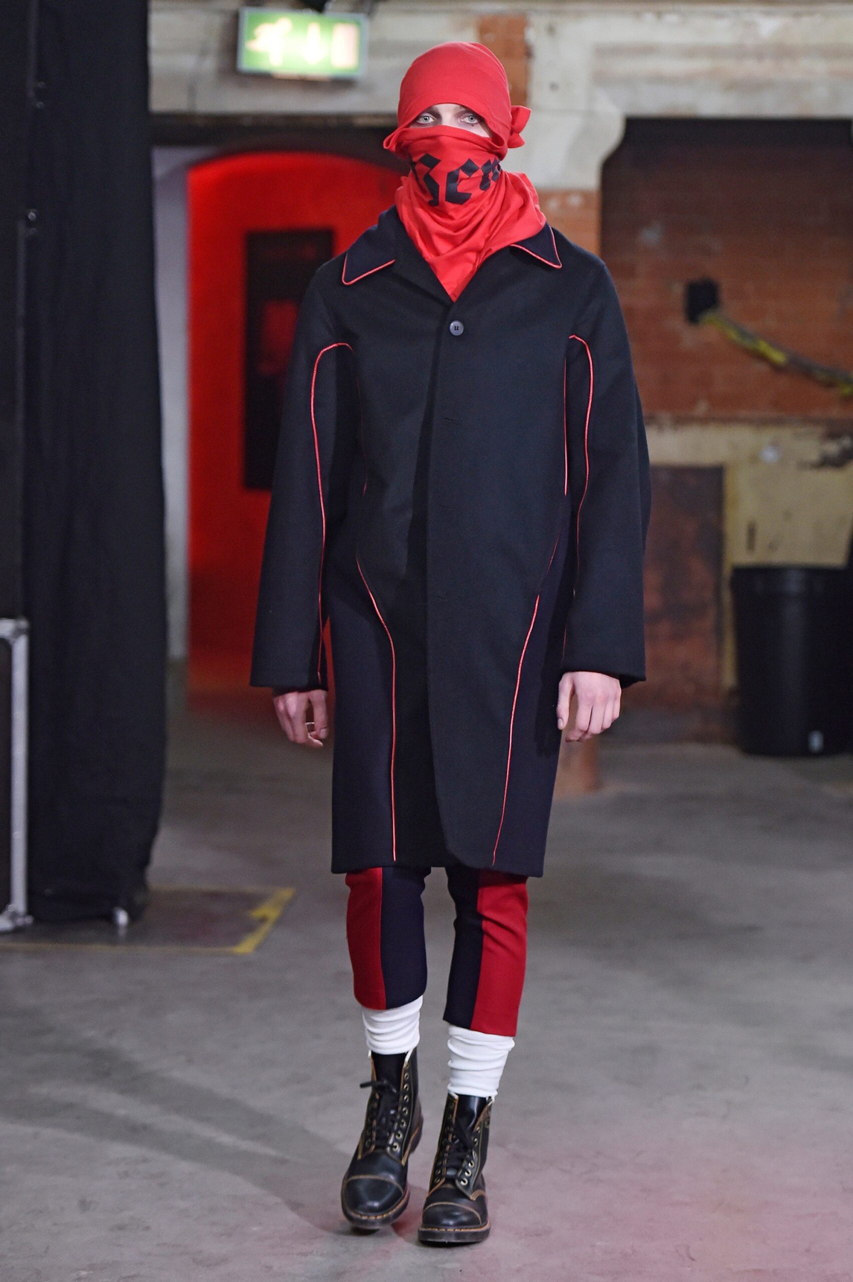 black wool coat with color-blocked pants