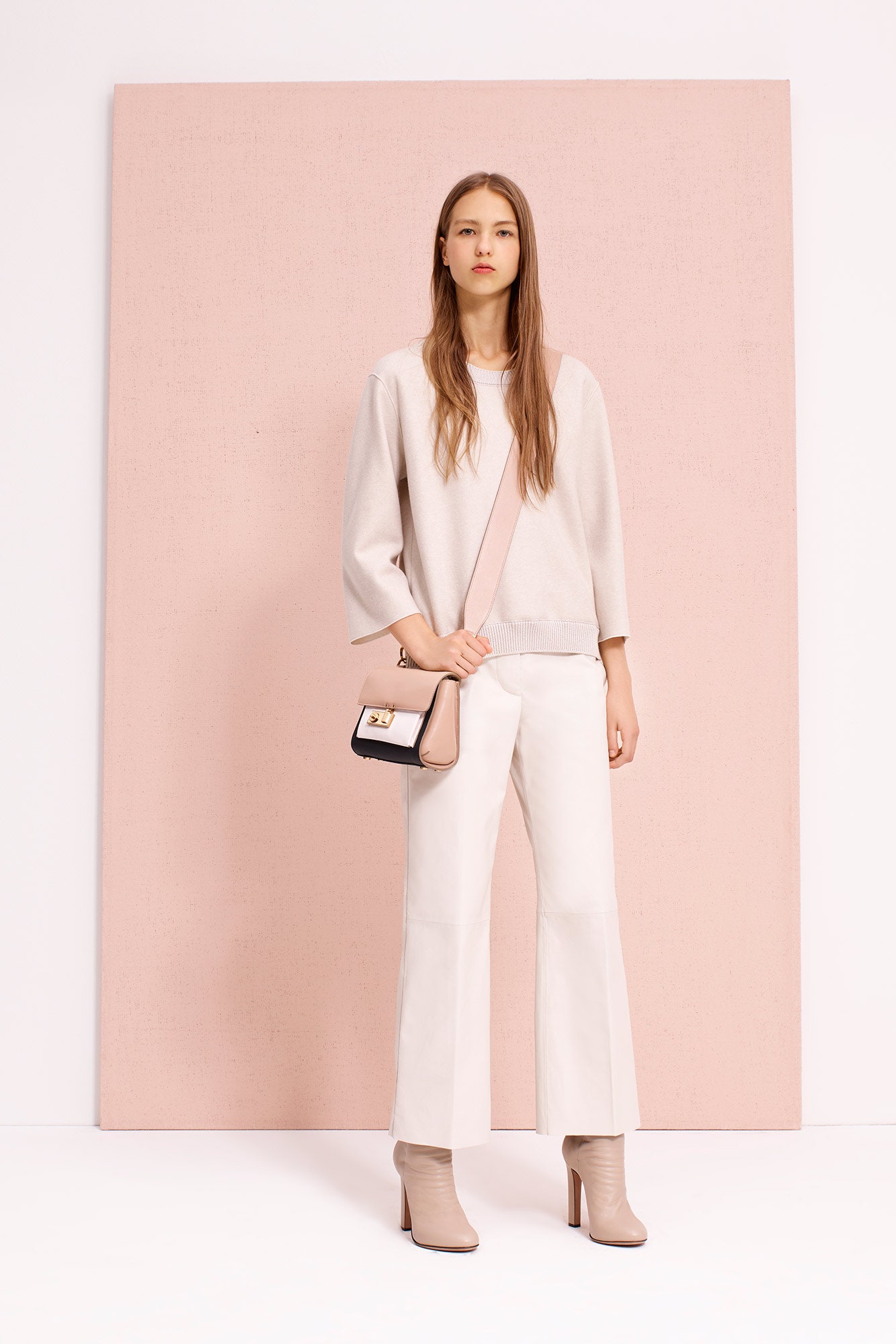 white relaxed top with flared pants