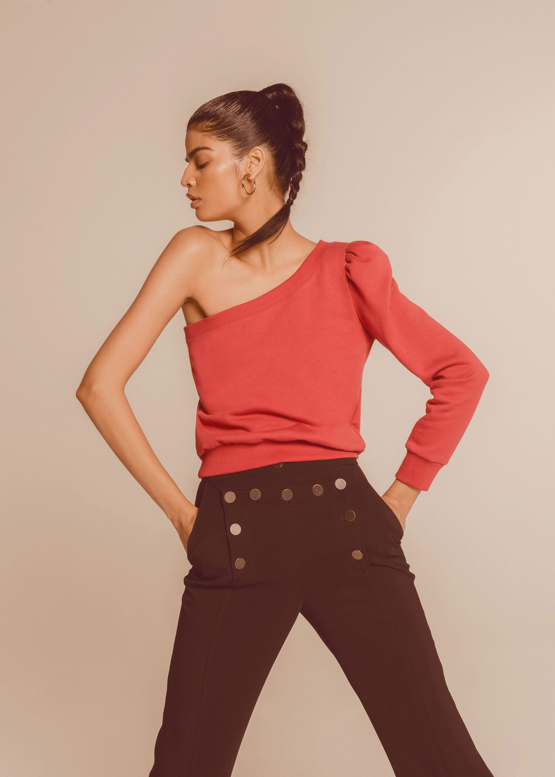 red off-shoulder top and black pants