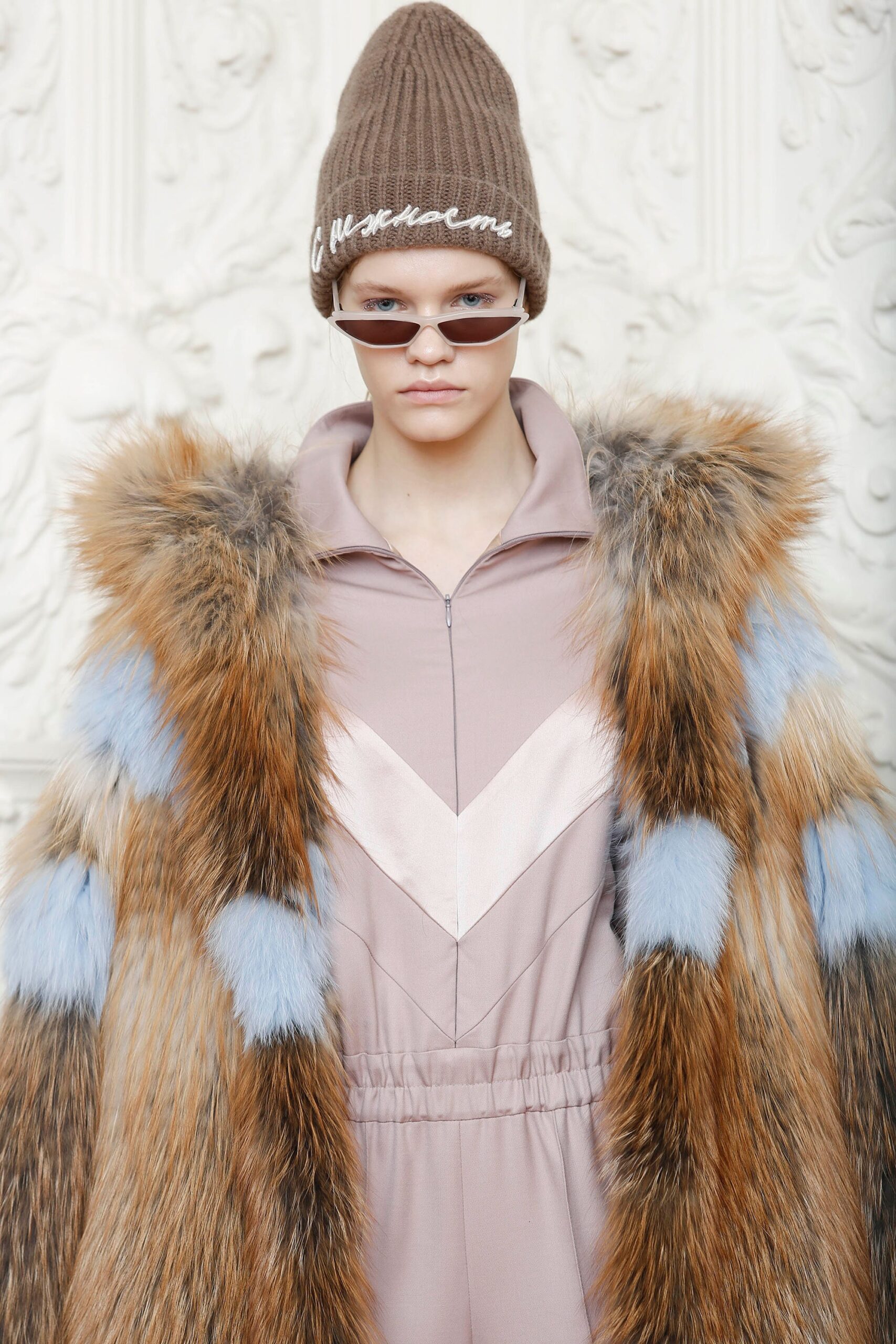 brown fur coat with pink jumpsuit