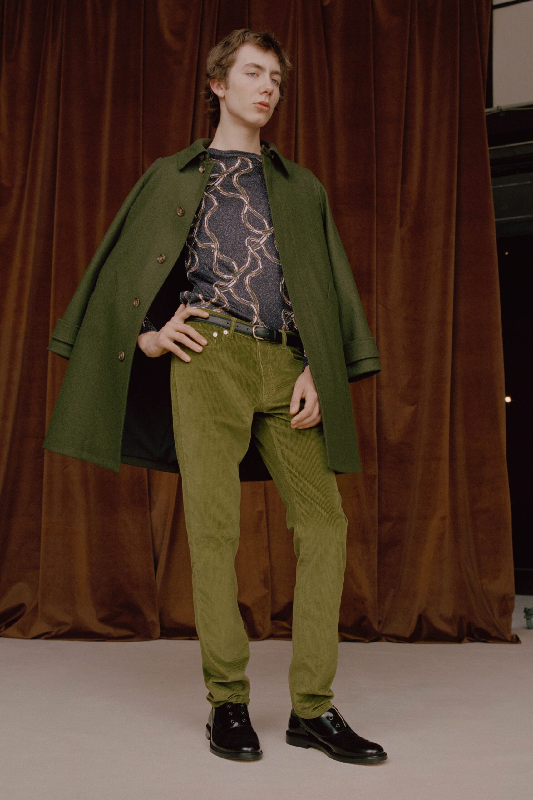 green wool coat with blue printed top