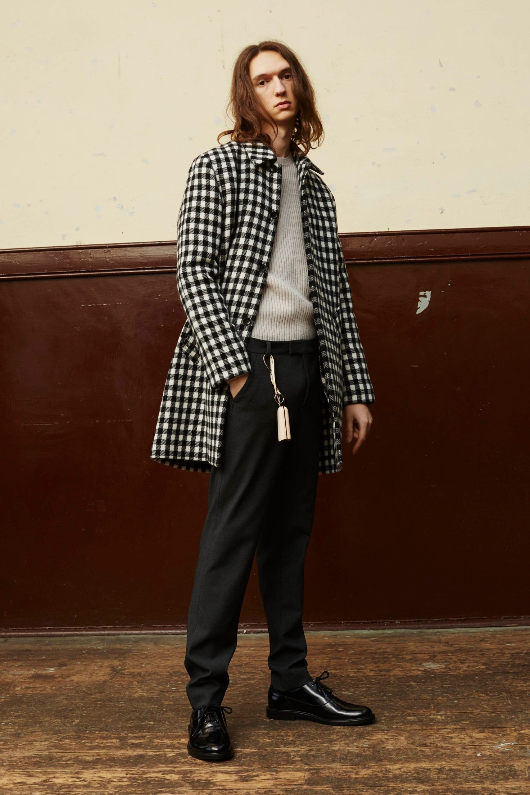 checked coat with fitted sweater