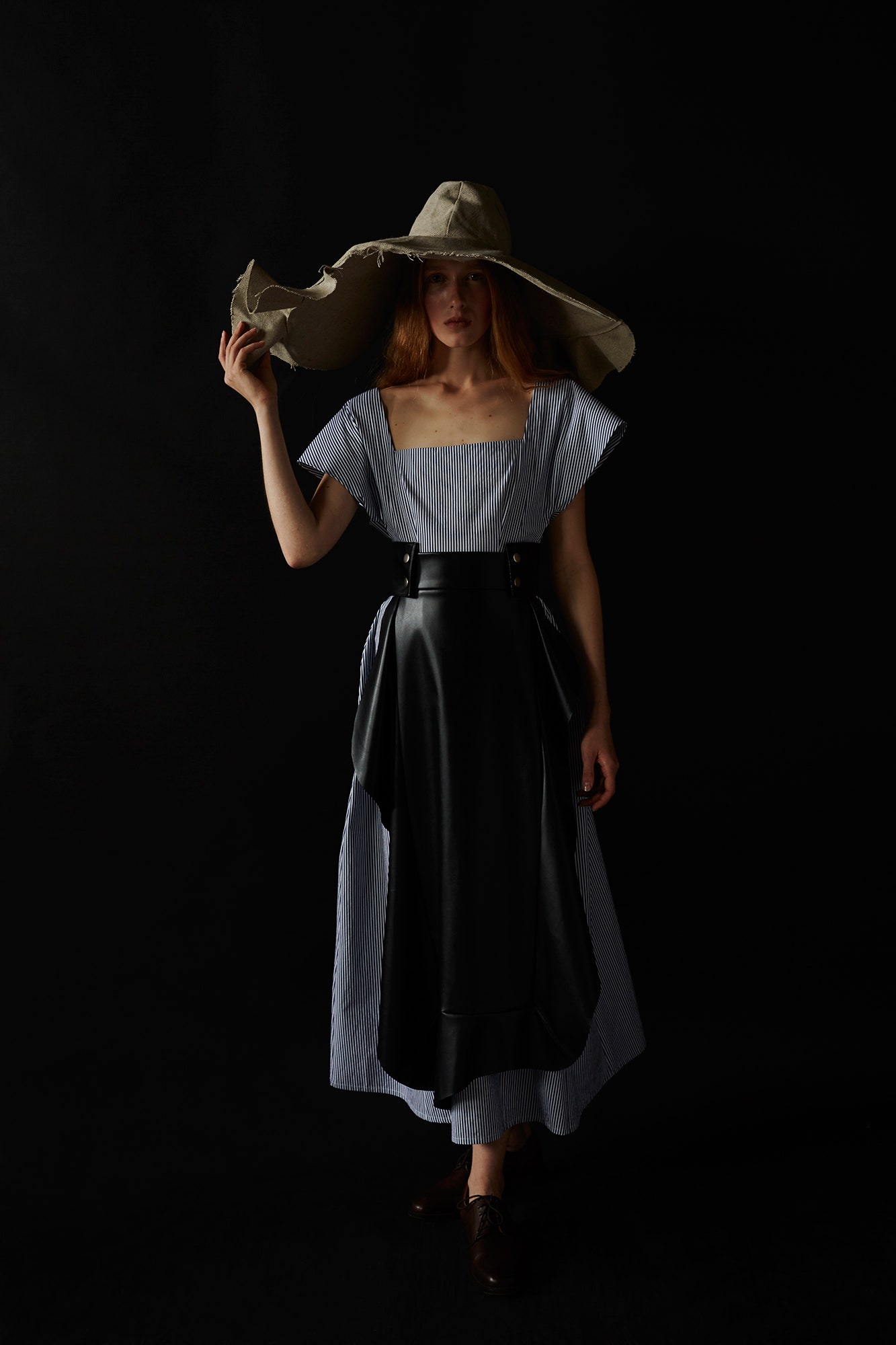 blue and white midi dress with wide-brimmed hat
