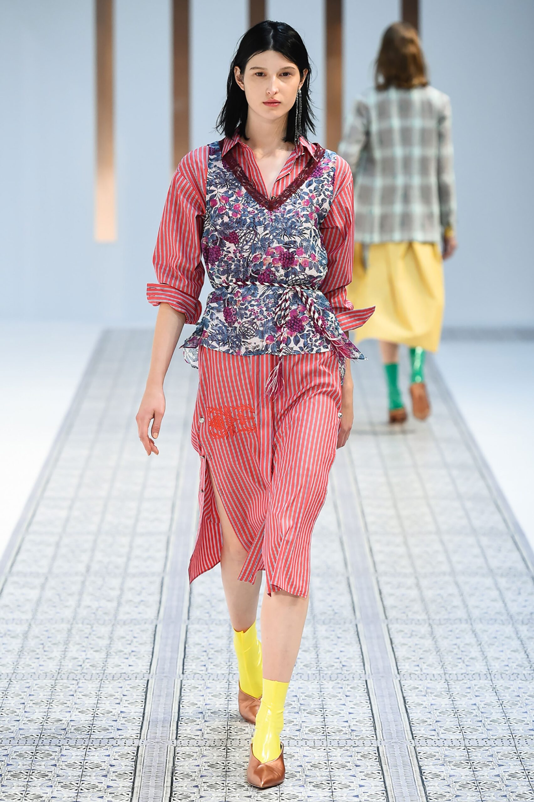A relaxed red and blue layered dress with a V-neckline and sleeveless design.