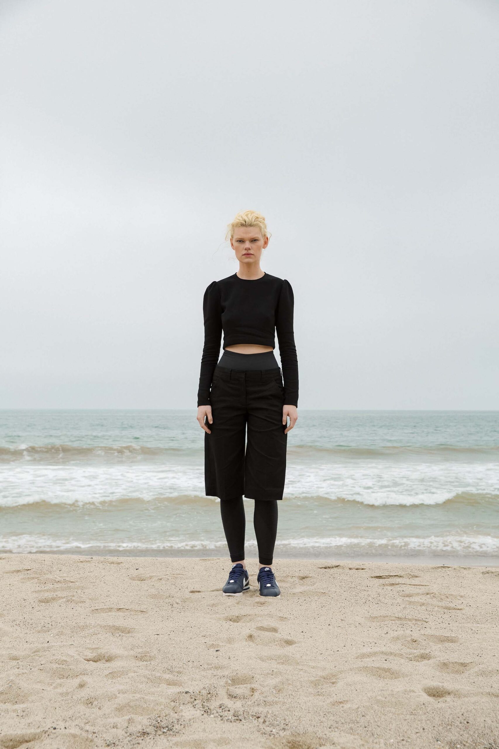 black fitted cropped top and relaxed pants