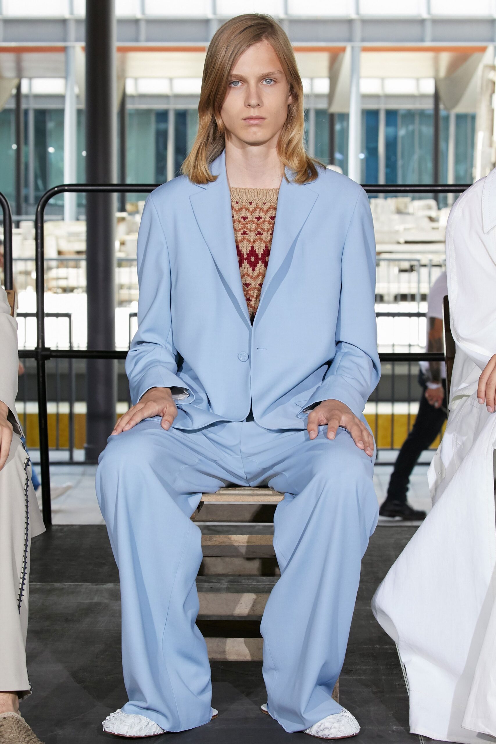 blue tailored suit with embroidered top