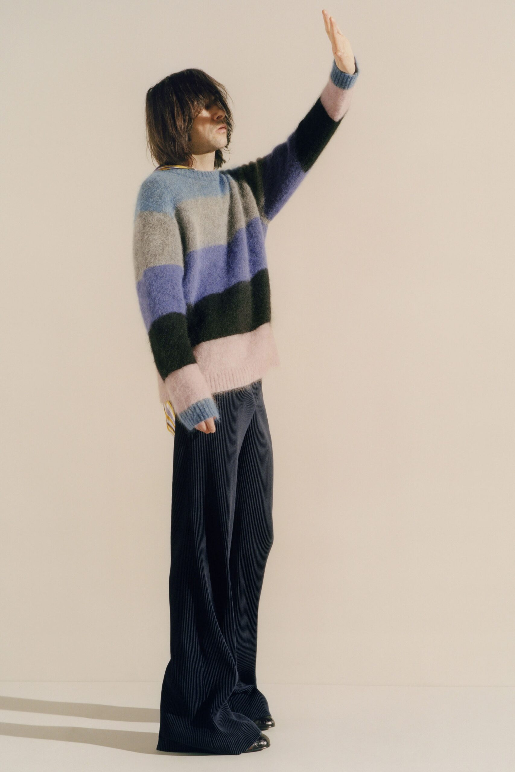 striped wool sweater and black pants