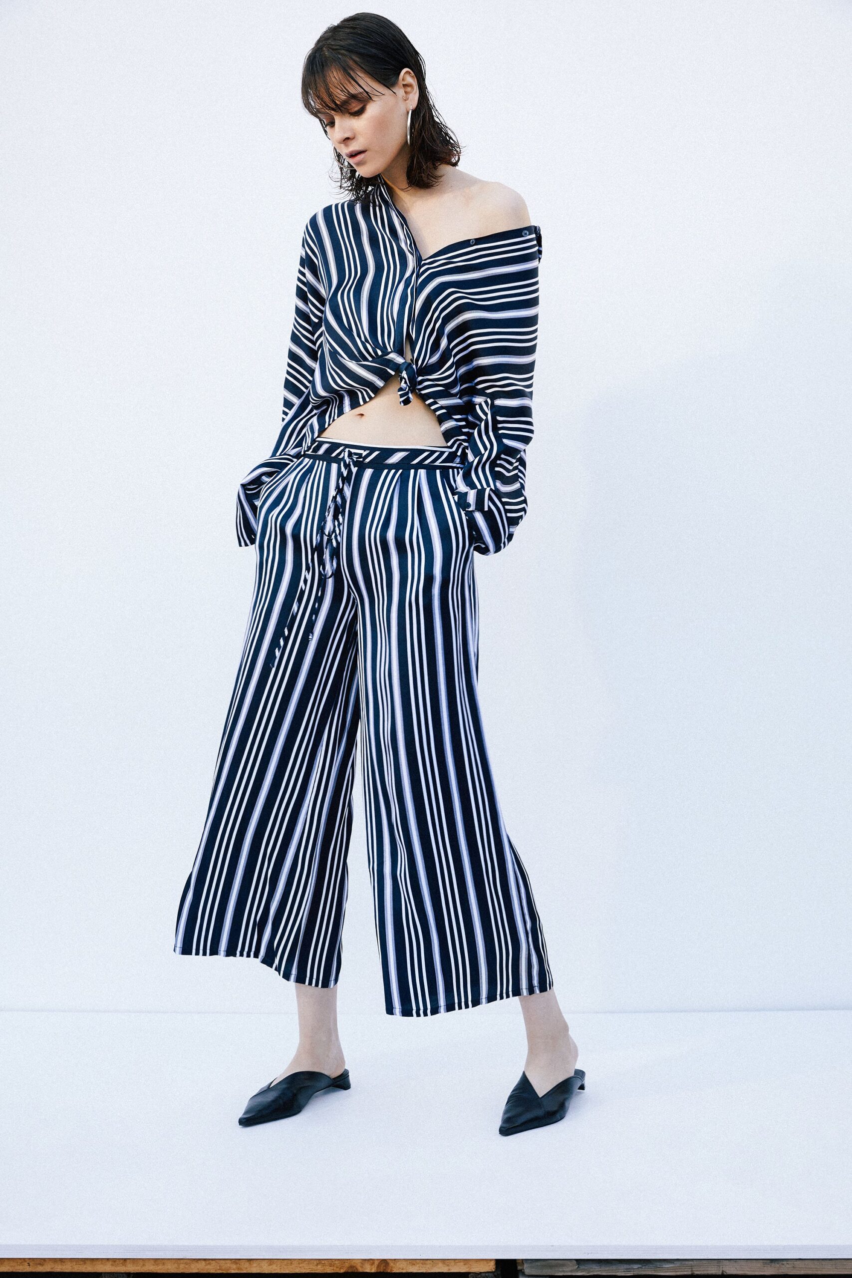 black long-sleeve off-shoulder fitted striped cropped top