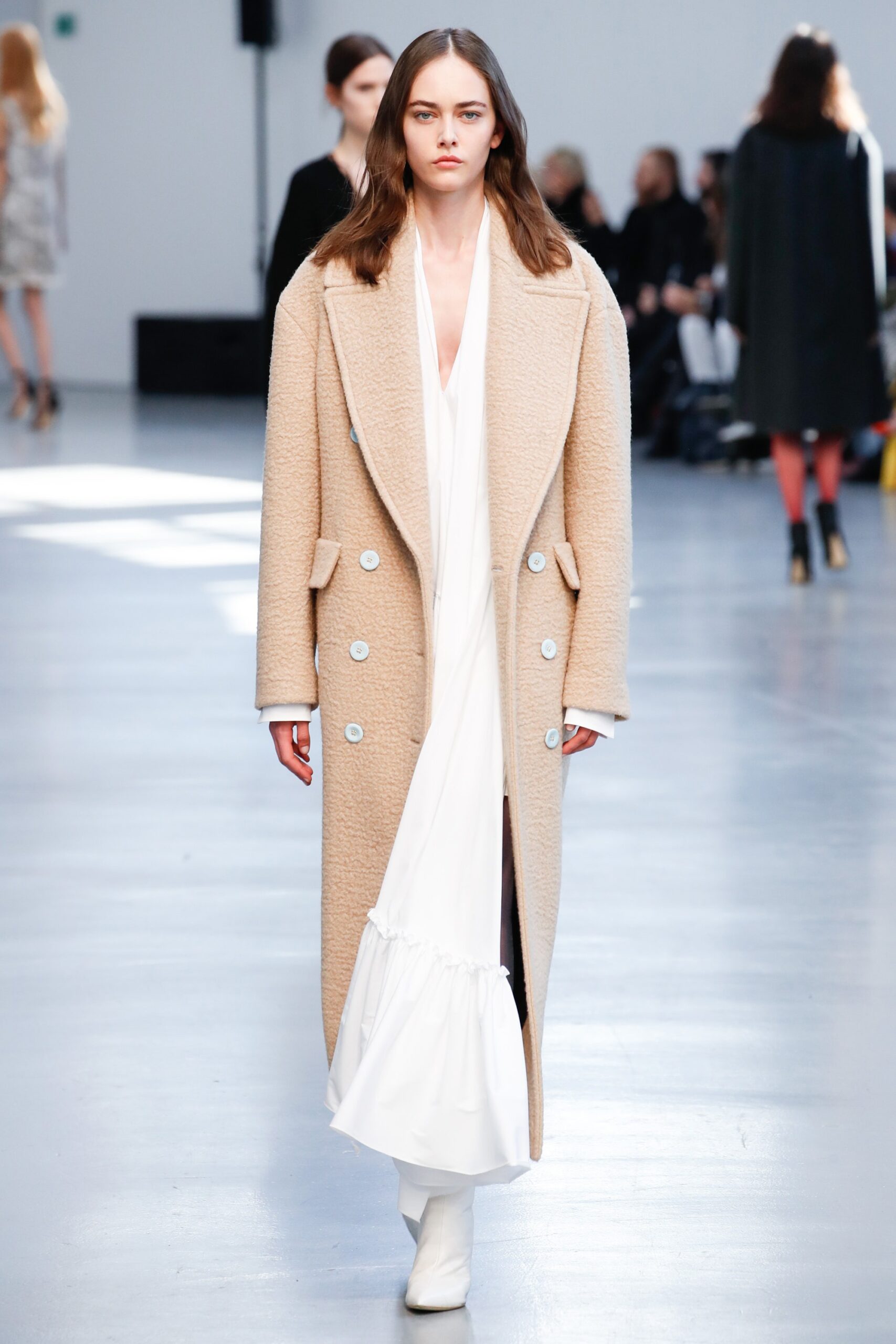 beige wool coat and white silk dress