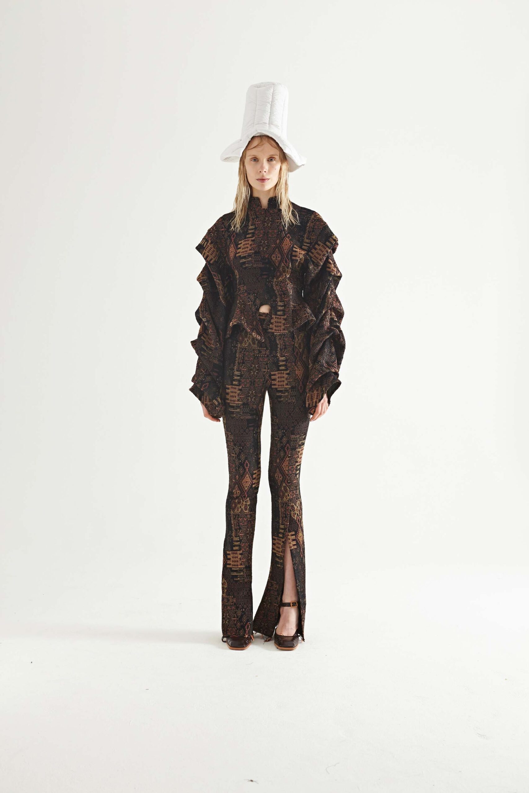 brown ruffled top and flared pants