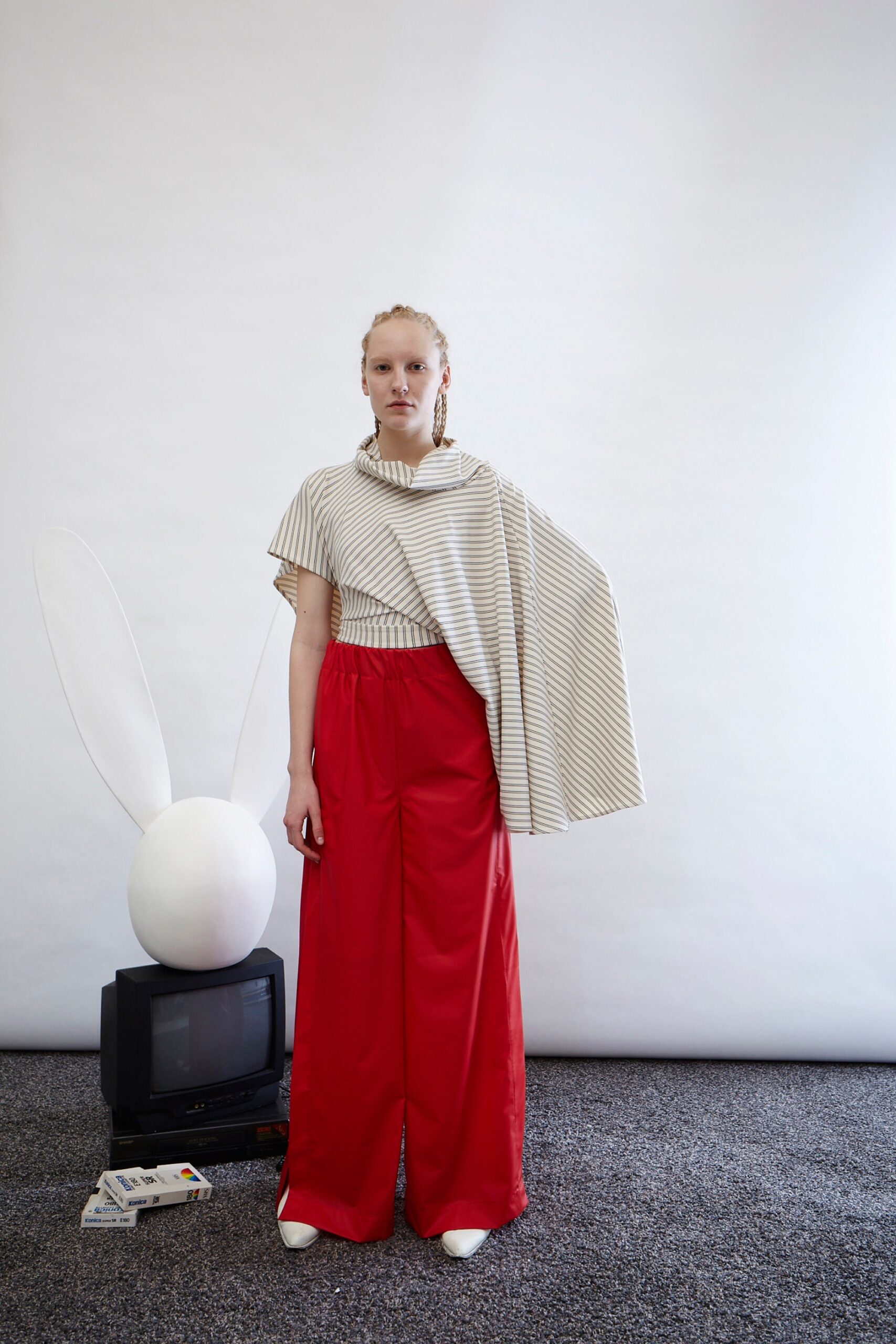 striped top and red wide-leg pants