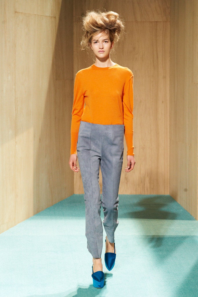 orange fitted top gray pants