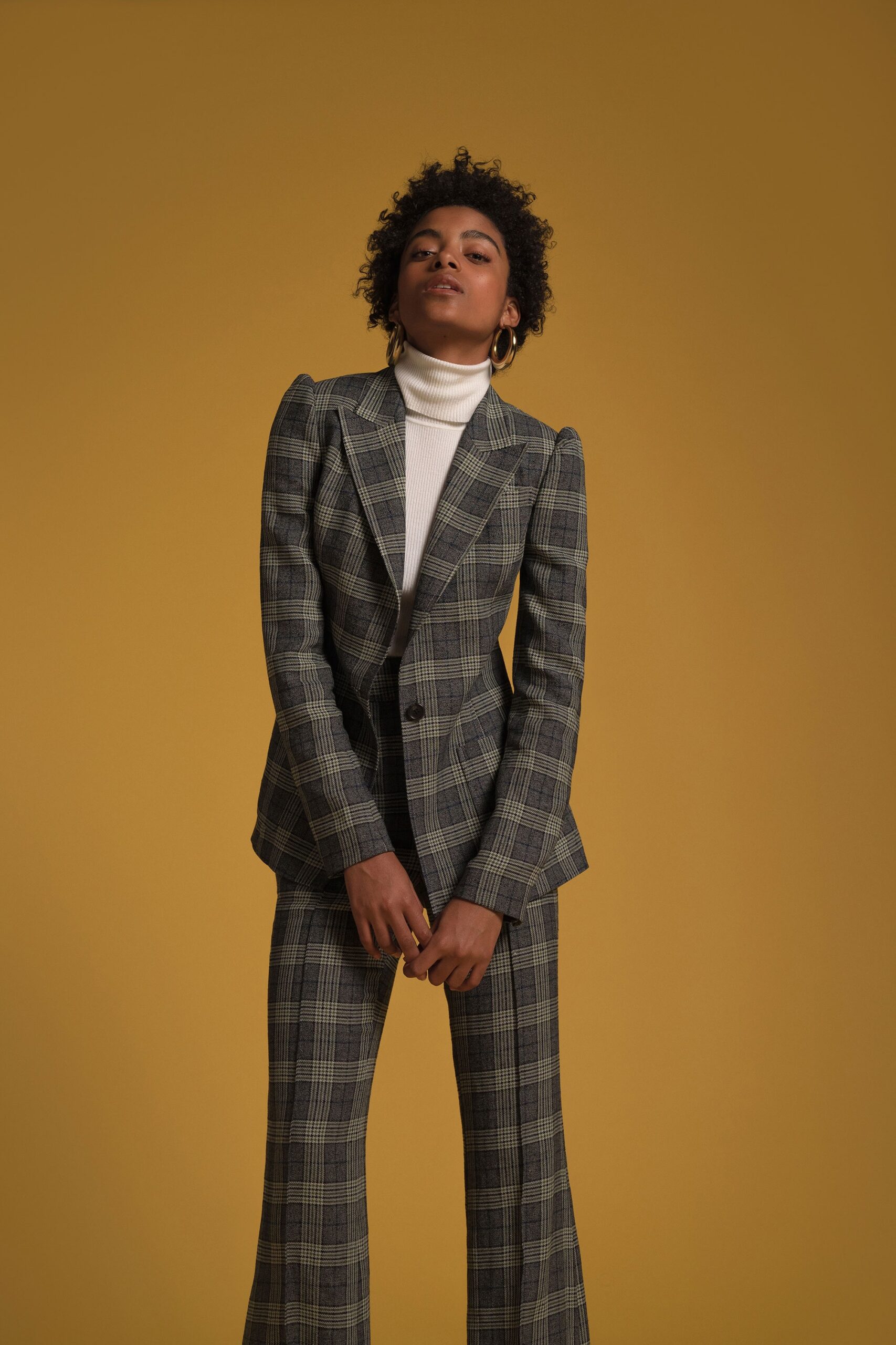 tailored green checked suit with turtleneck