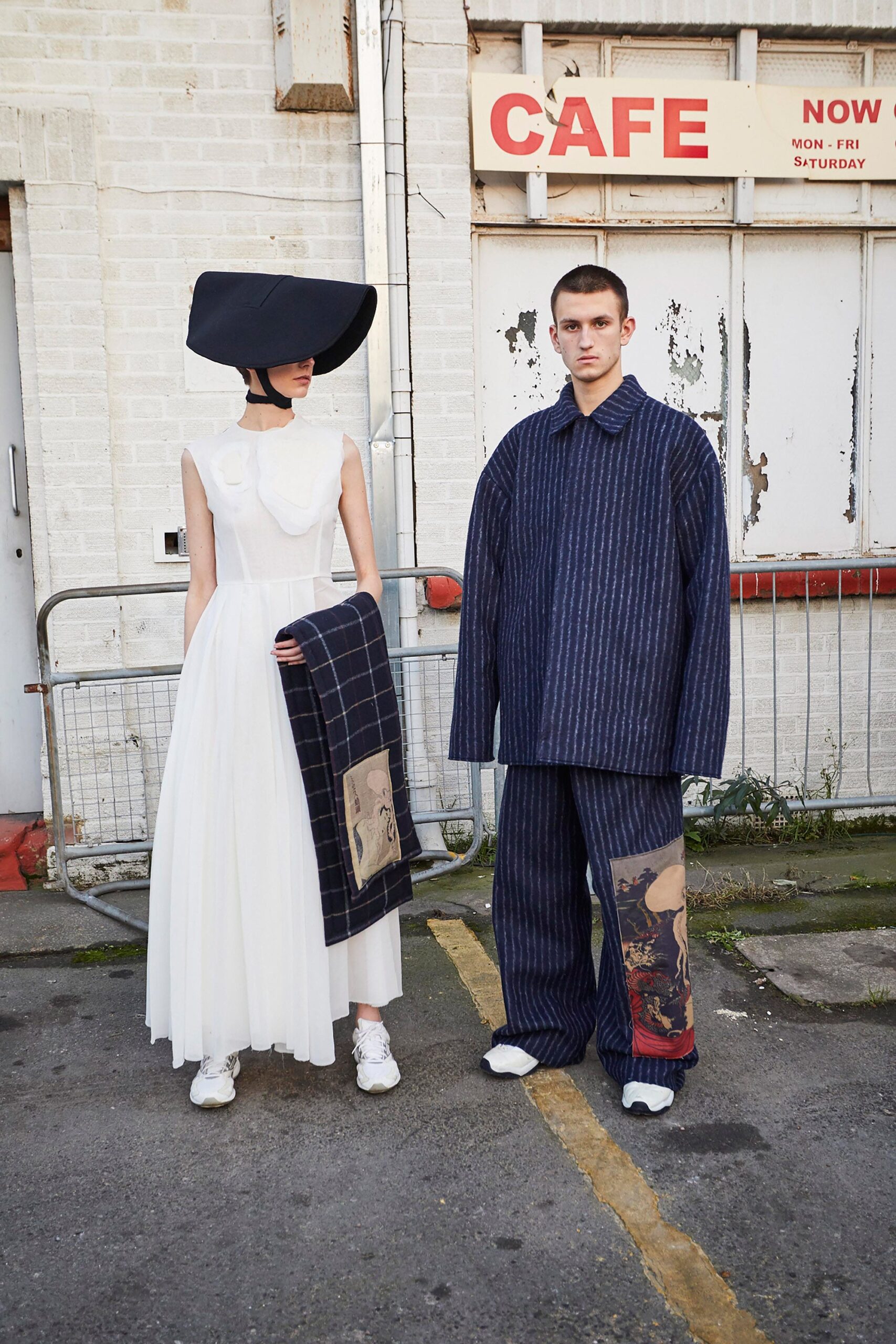 white midi dress with black hat