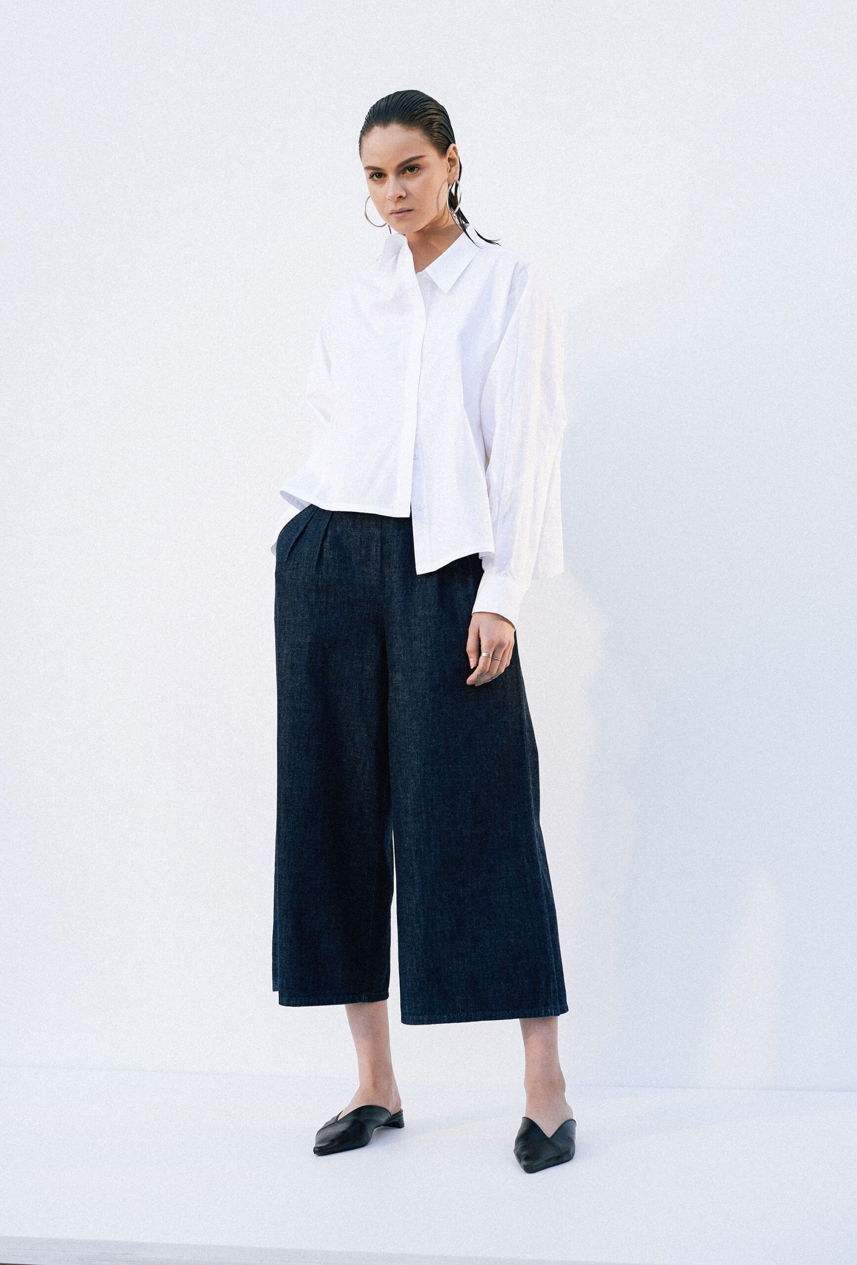 white relaxed shirt with blue wide-leg pants