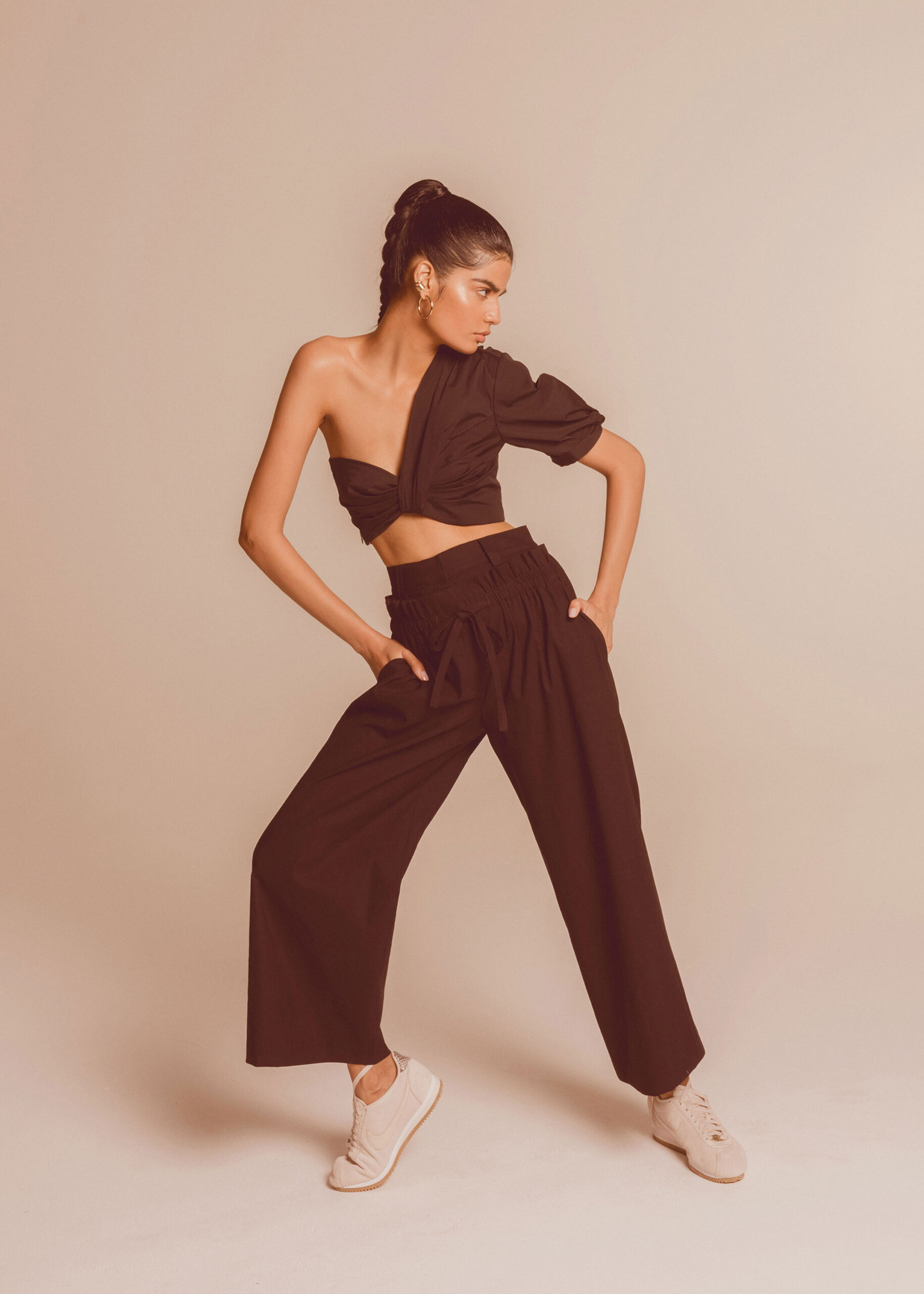 black asymmetric top with relaxed pants