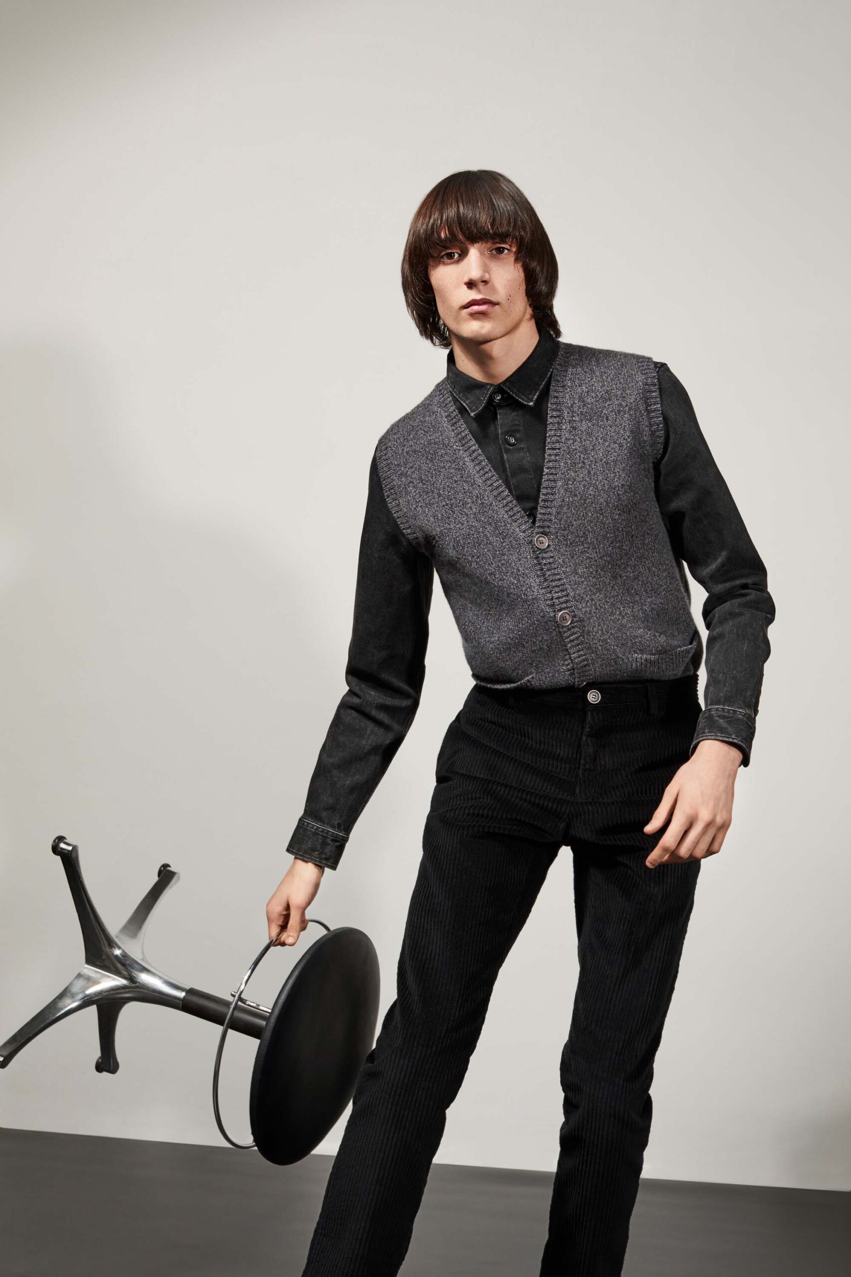 gray wool vest black shirt black pants
