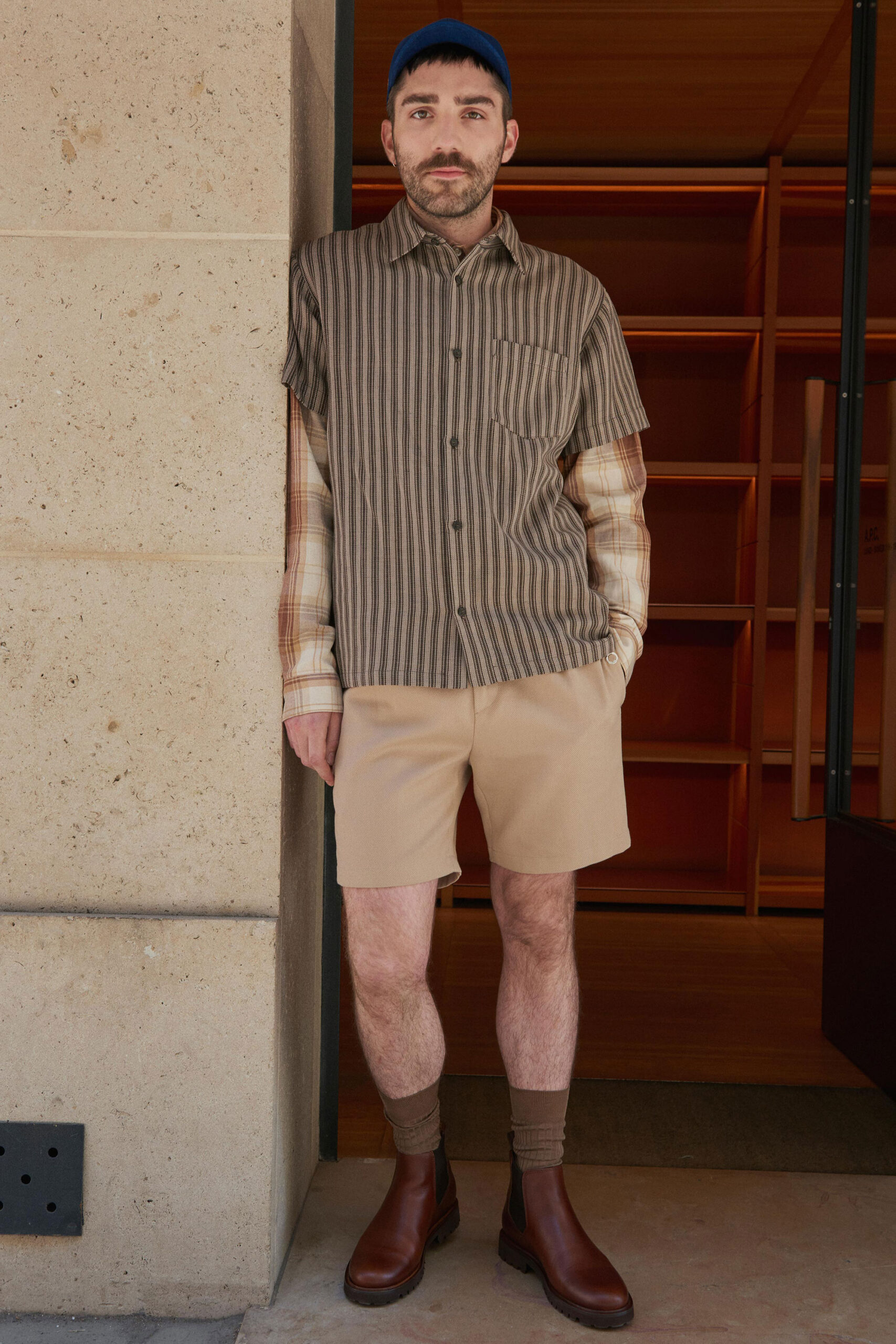 brown striped shirt with beige shorts