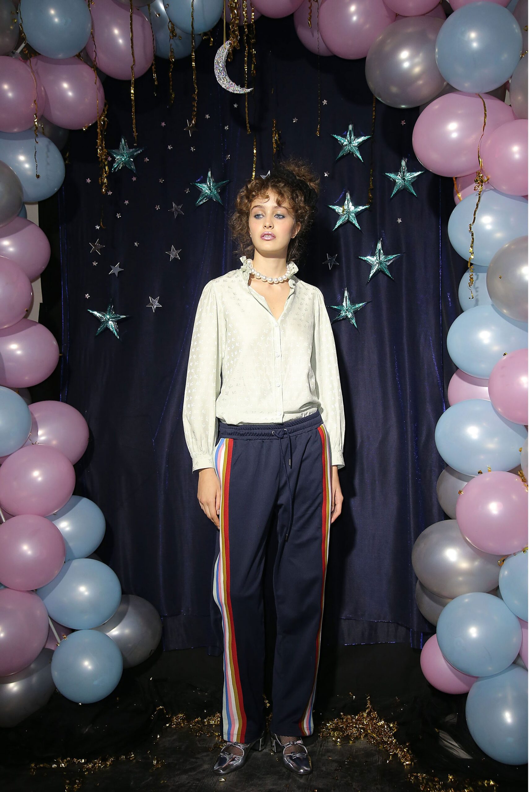 white relaxed shirt and navy pants
