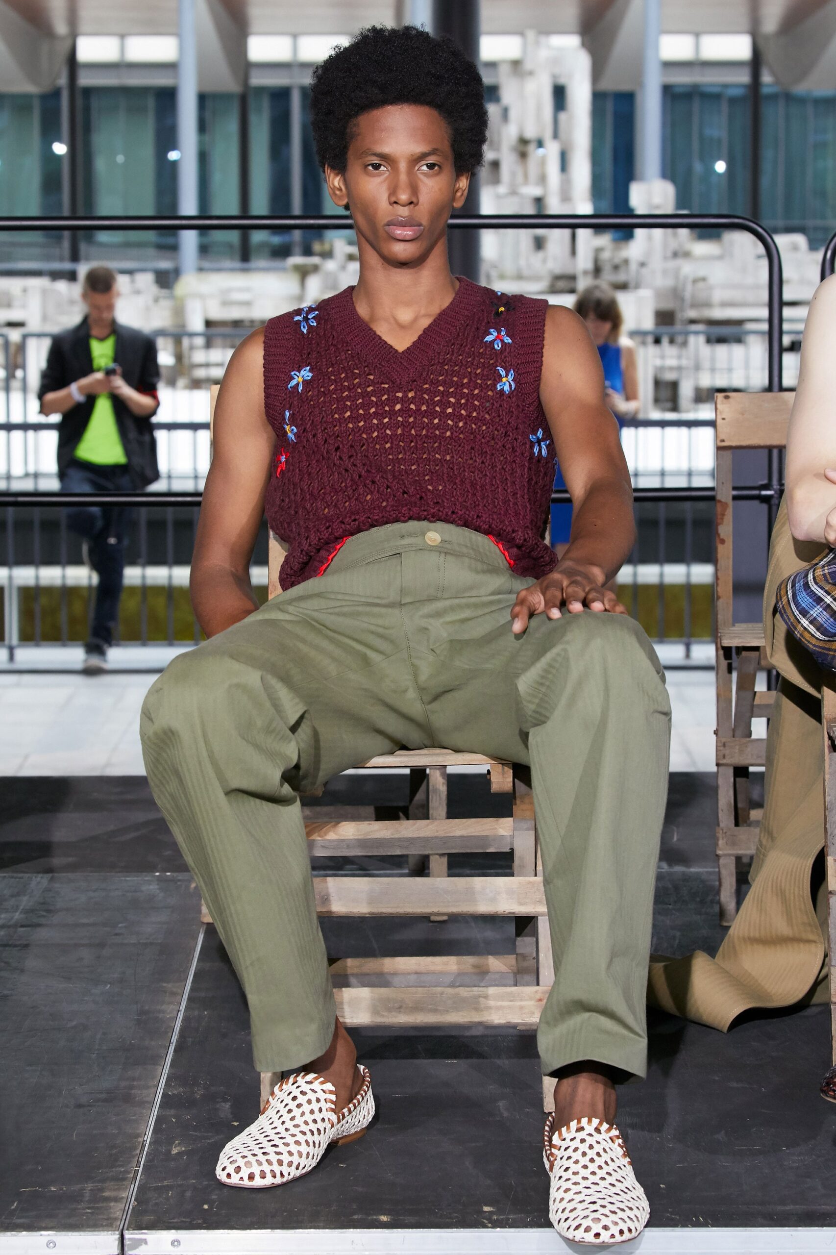 burgundy vest with green pants