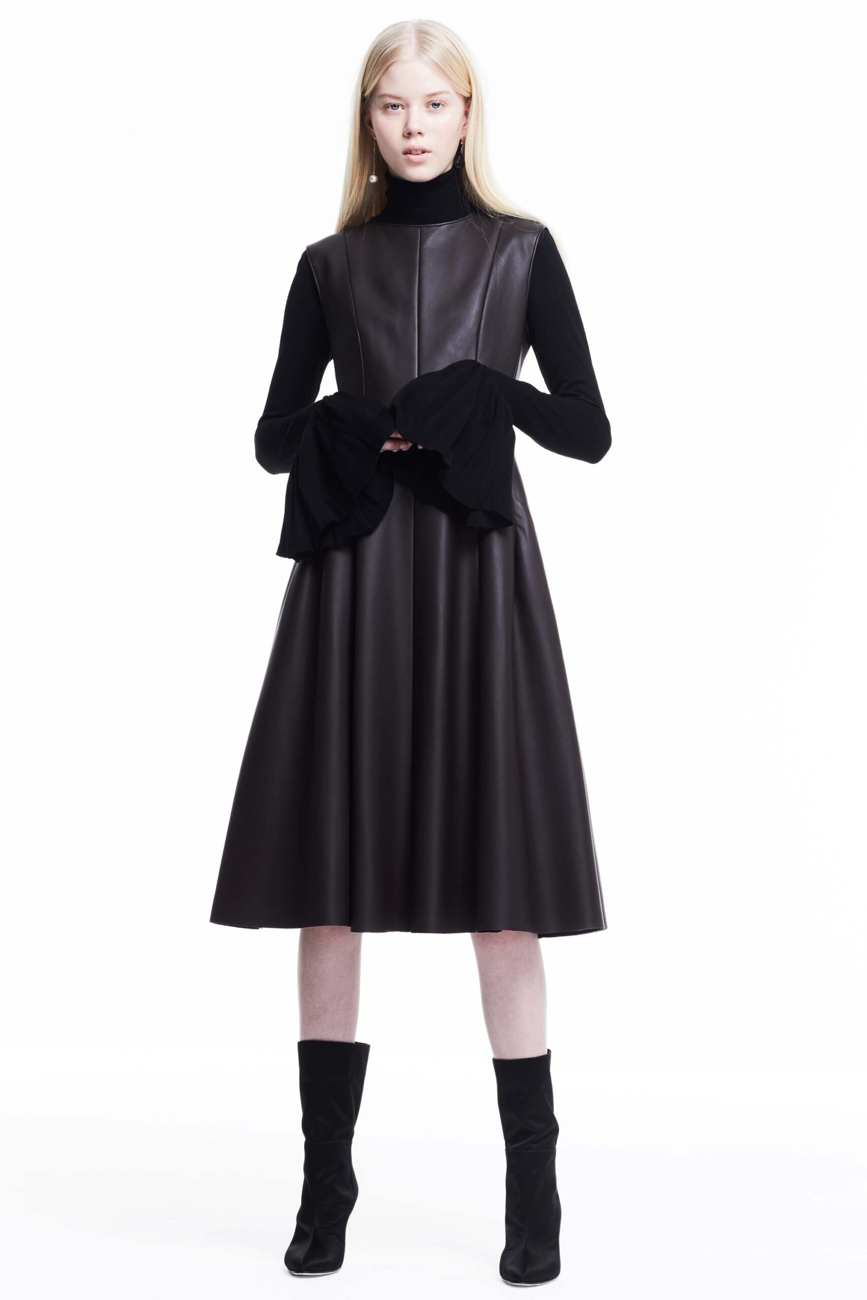 black leather midi dress and black turtleneck top
